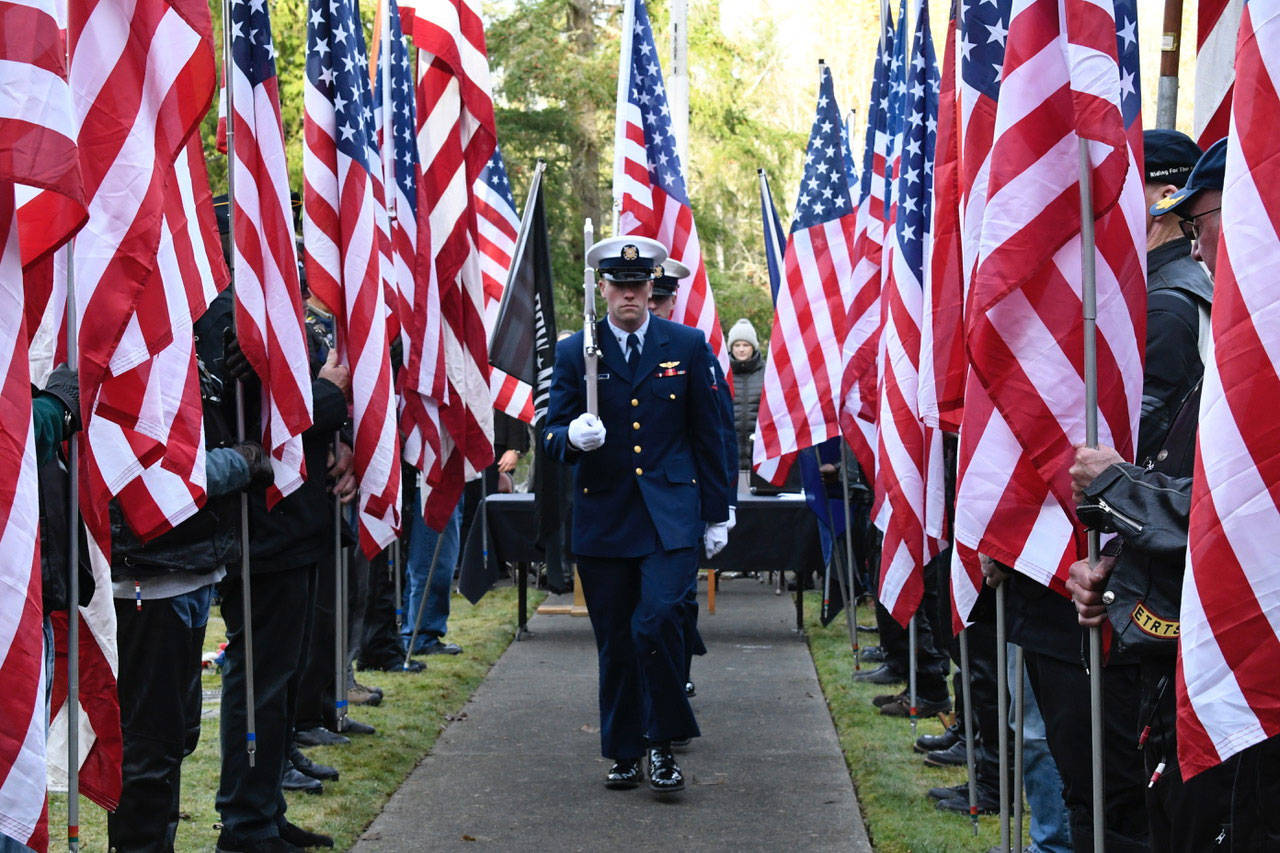 The Retrieving of the Colors ceremony concluded the memorial service for U.S. Navy Petty Officer Marvin G. Shields on Monday at the Gardiner Cemetery. (Jeannie McMacken/Peninsula Daily News)