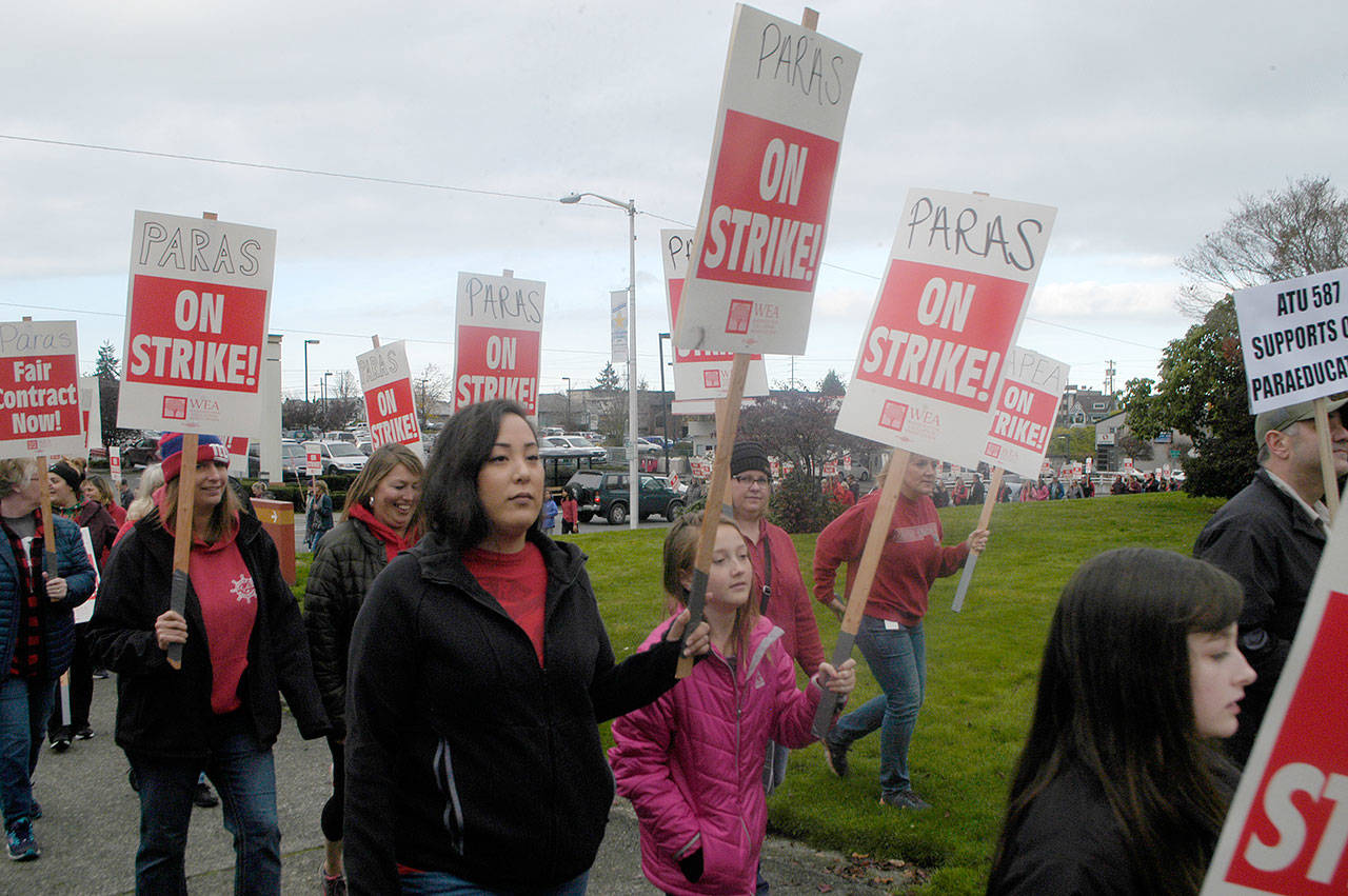 More than 150 teachers and paraeducators ended their demonstration in downtown Port Angeles, circling past the courthouse, supporting the paraeducators’ strike. (Paul Gottlieb/Peninsula Daily News)