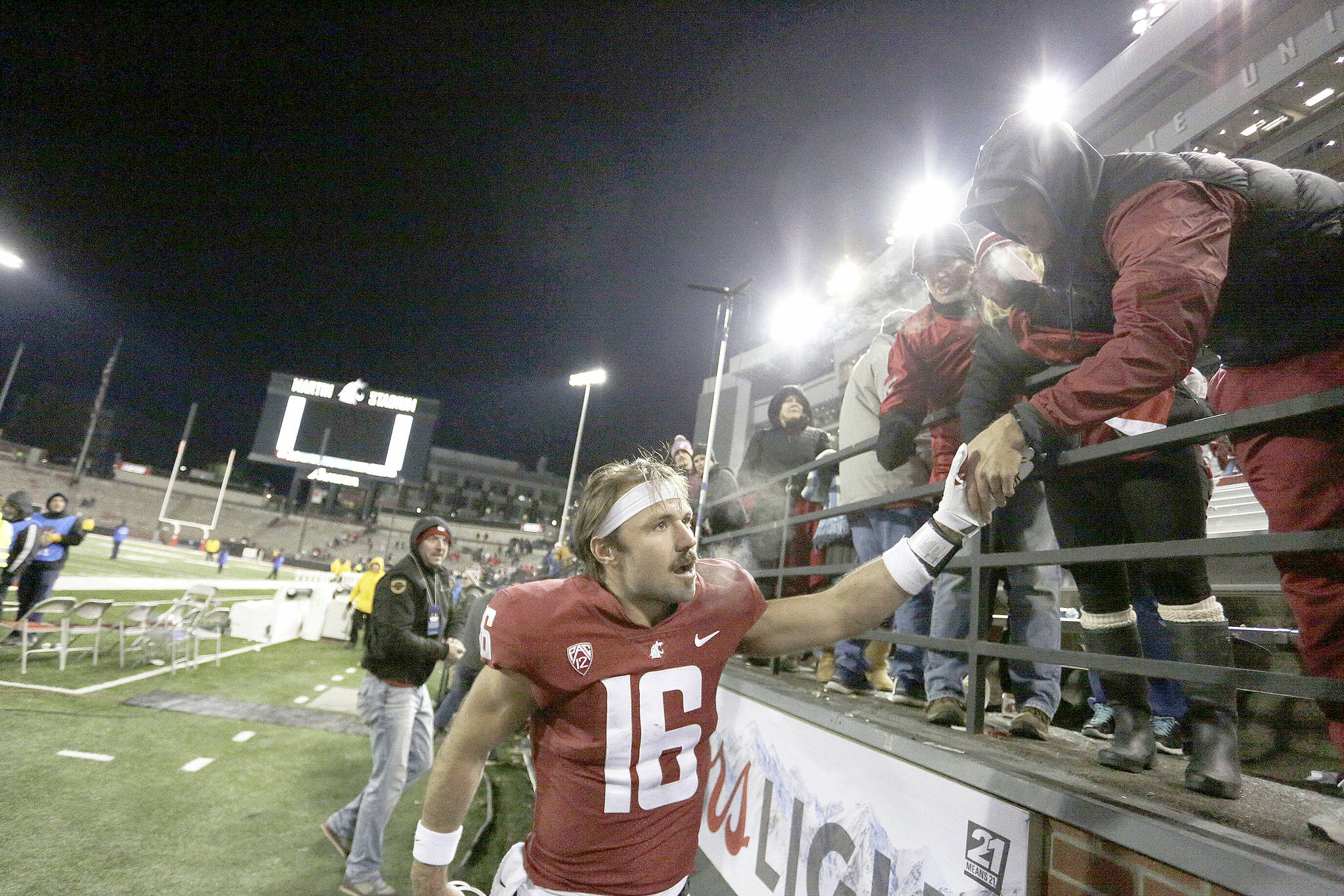 The Associated Press                                Washington State quarterback Gardner Minshew celebrates with fans after throwing seven touchdown passes in a 69-28 win over Arizona last Saturday.