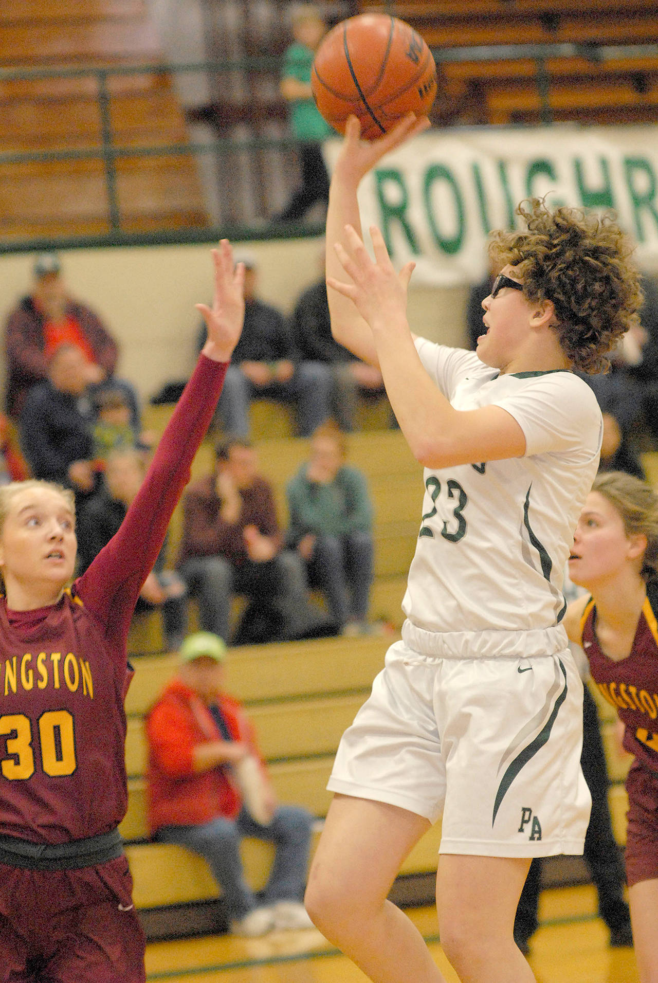 Keith Thorpe/Peninsula Daily News Port Angeles’ Madison Cooke puts up a running one-hand shot against Kingston last season.