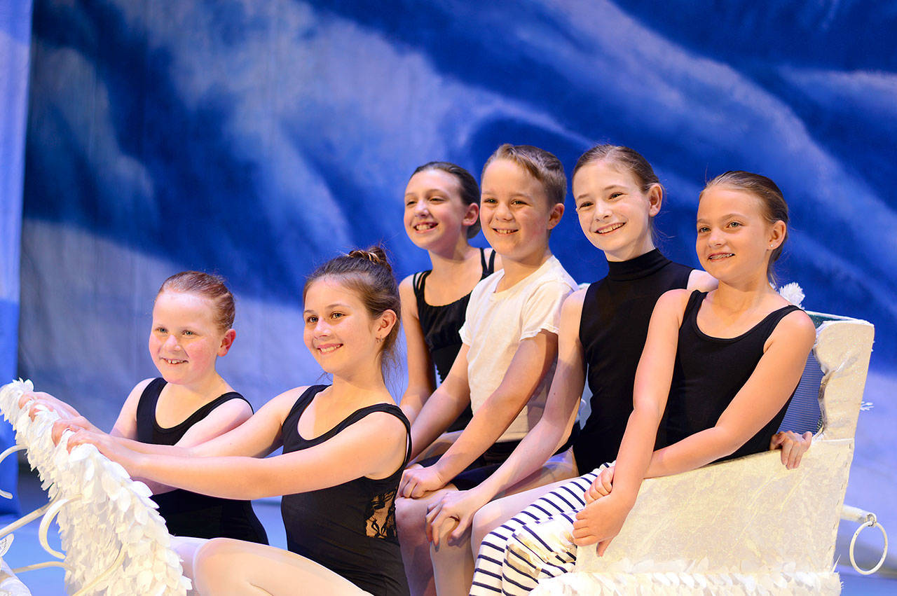 A sleighful of dancers glides onstage in “The Nutcracker” with, from left, Anna Miller, 8, of Joyce; Belladonna Laidig, 10 and Amelia Brown, 11, both of Port Angeles; Ivan Miller, 10, of Joyce; Faerin Tait, 11, and Audrey Rudd, 9, both of Port Angeles. (Diane Urbani de la Paz/for Peninsula Daily News)