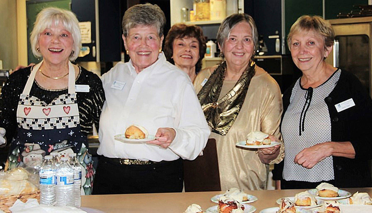 Sequim Soroptimists, from left, Mary Fasching, Monica Ostrom, Becky Archer, Gail Watson and Janet Real sell homemade cinnamon rolls at the 2017 Gala Gift Show Holiday Café.