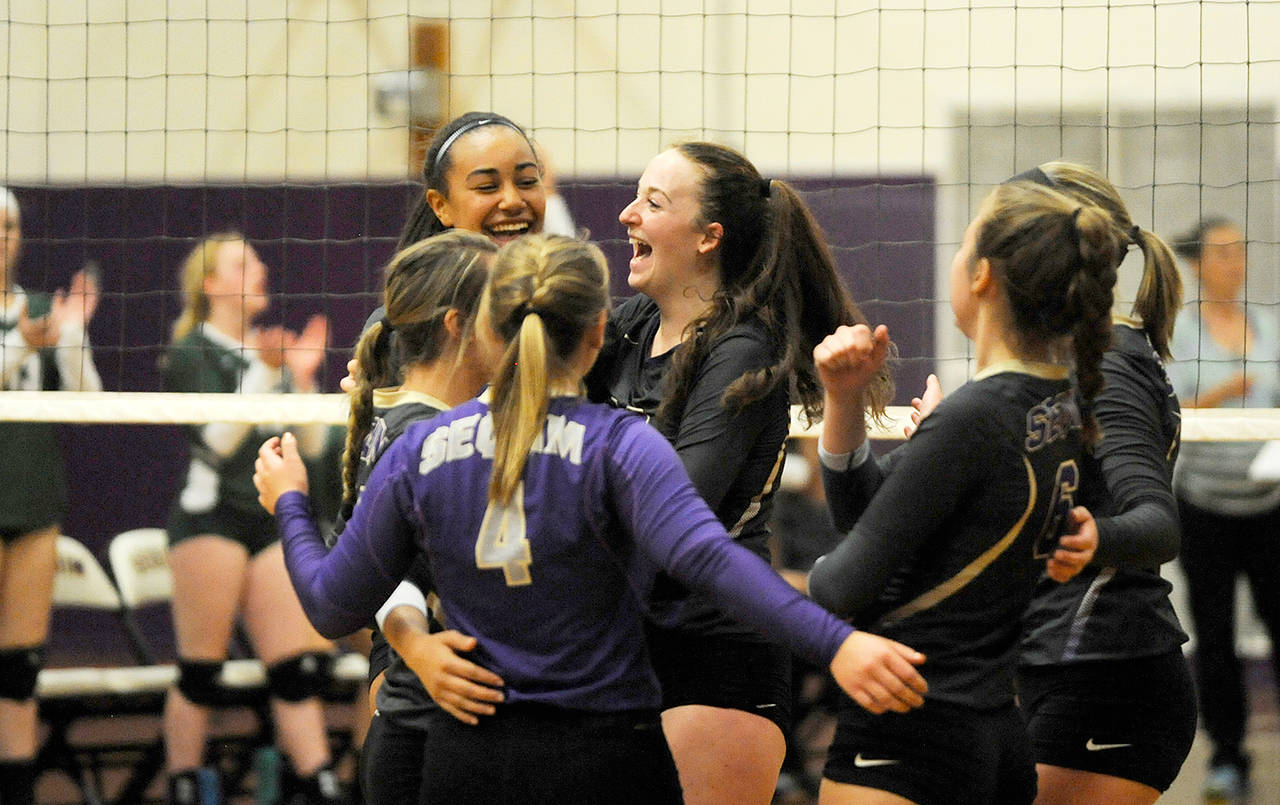 Michael Dashiell/Olympic Peninsula News Group Despite playing outside hitter Sequim’s Tayler Breckenridge, center, was in the middle of it all for the Wolves volleyball team.