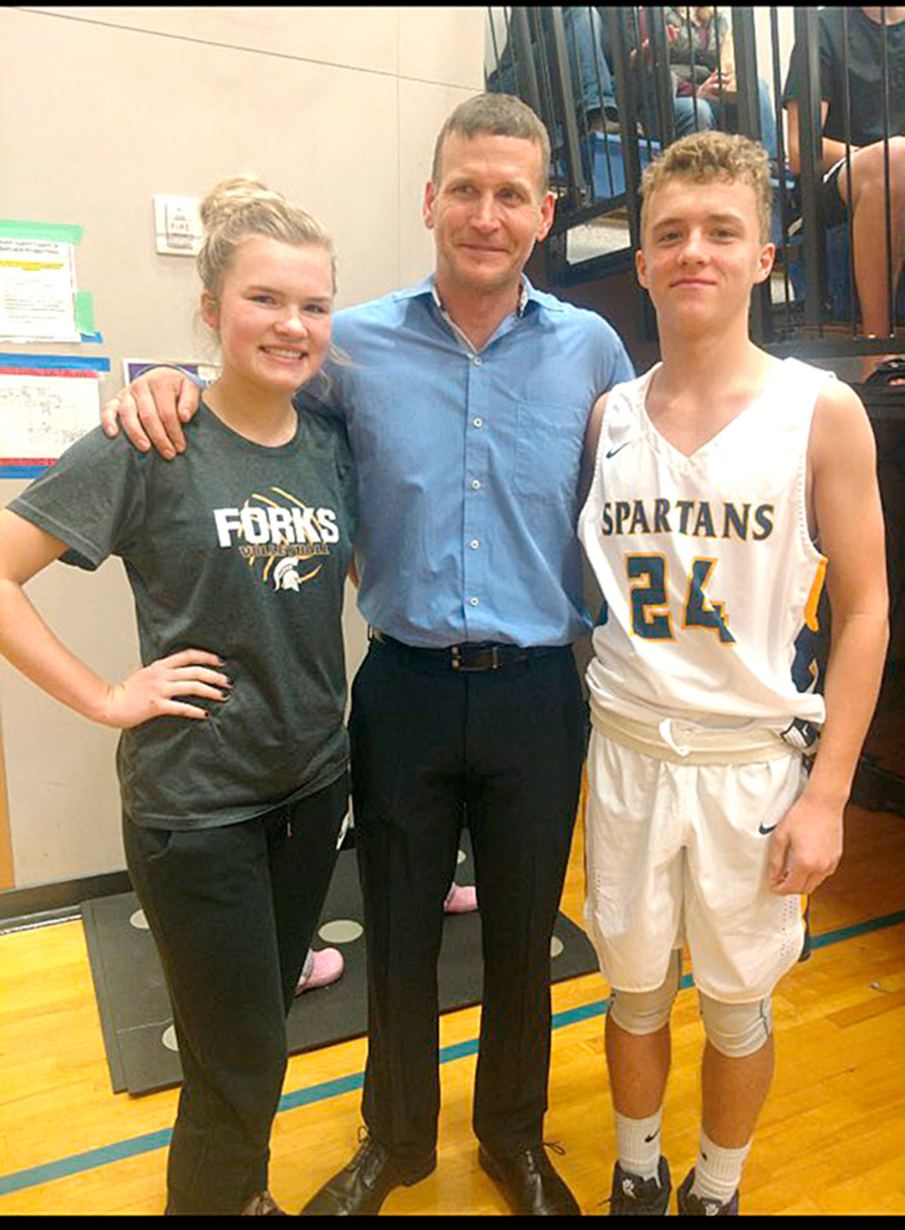 2000 Forks High School graduate Kurt Olson (middle) was inducted into the Forks High School Athletic Hall of Fame last Friday. Olson is joined by his niece, Jayden Olson, a member of the Spartans girls basketball team and his nephew Logan, a Forks boys basketball player.