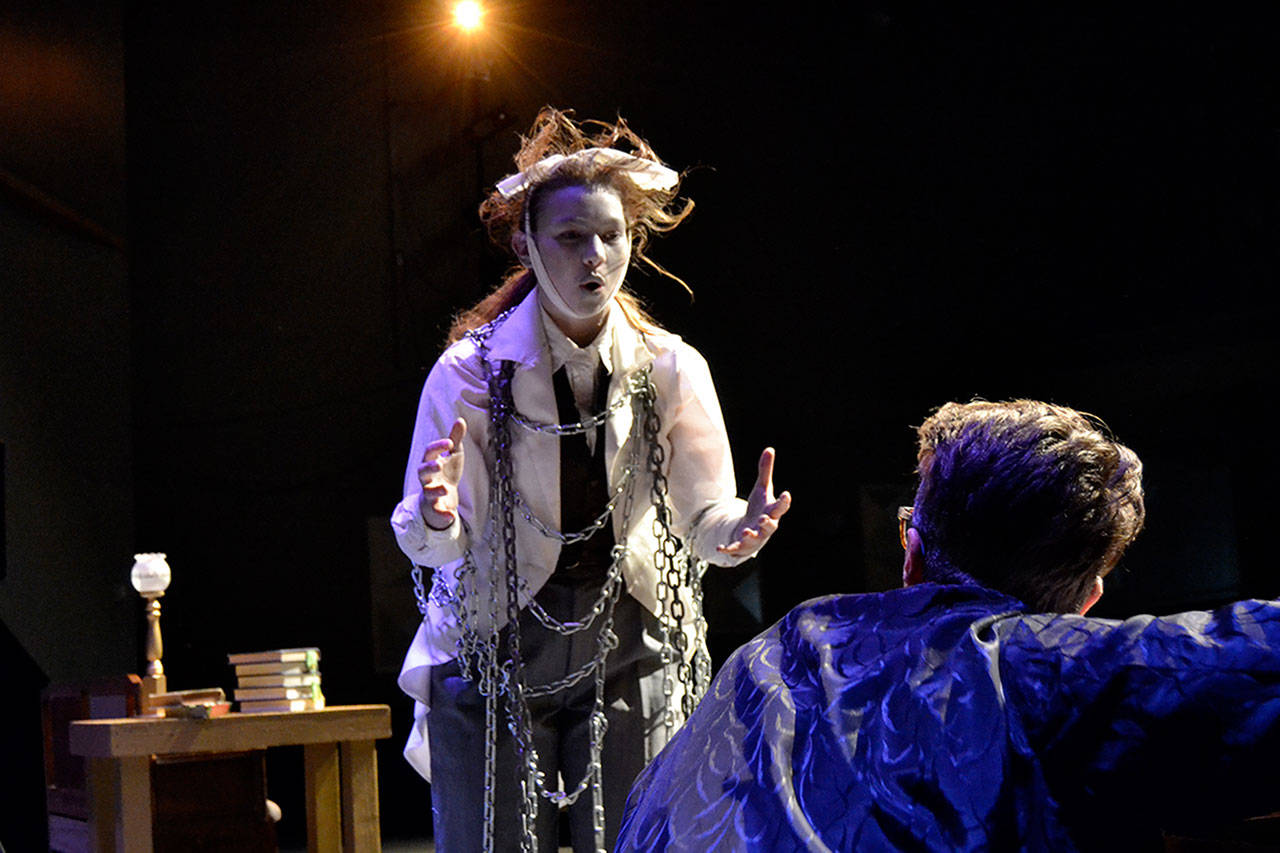 Jacob Marley (Maggie van Dyken) confronts Ebenezer Scrooge (Damon Little) in his home warning him about ghosts coming to visit him during Sequim High School’s production of “A Christmas Carol.” (Matthew Nash/Olympic Peninsula News Group)