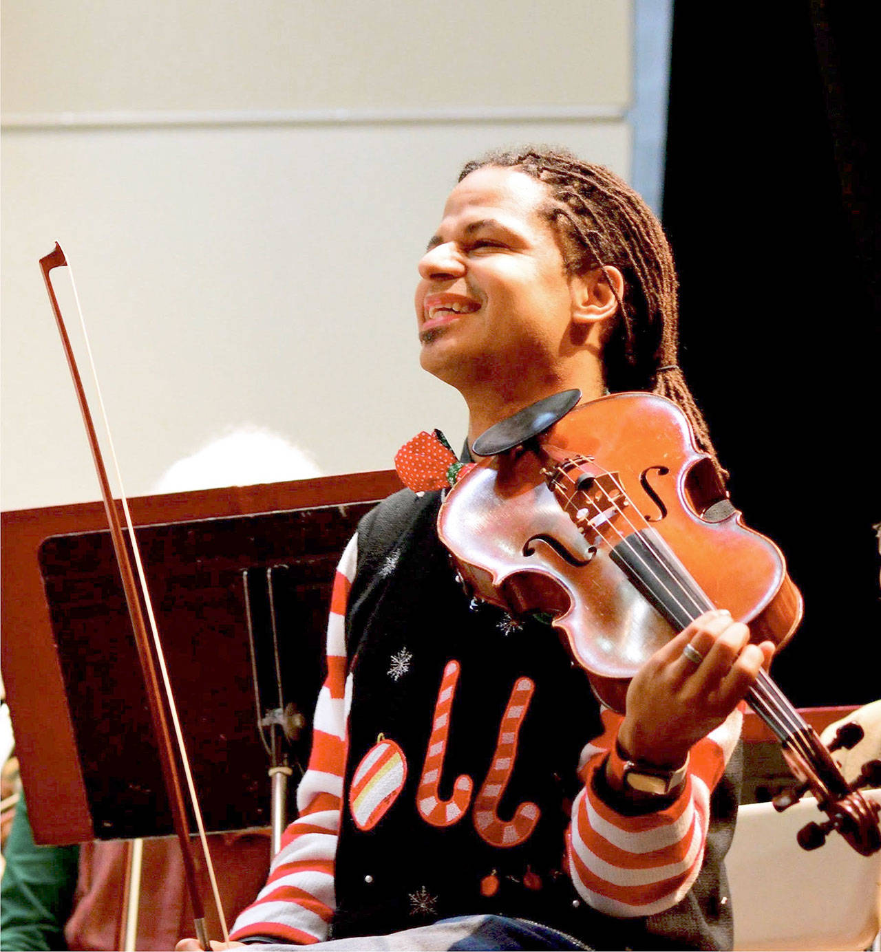 Violist Tyrone Beatty gets into the holiday mood during a Port Angeles Symphony Orchestra rehearsal. The symphony gives its Holiday Concert this Saturday. (Diane Urbani de la Paz)