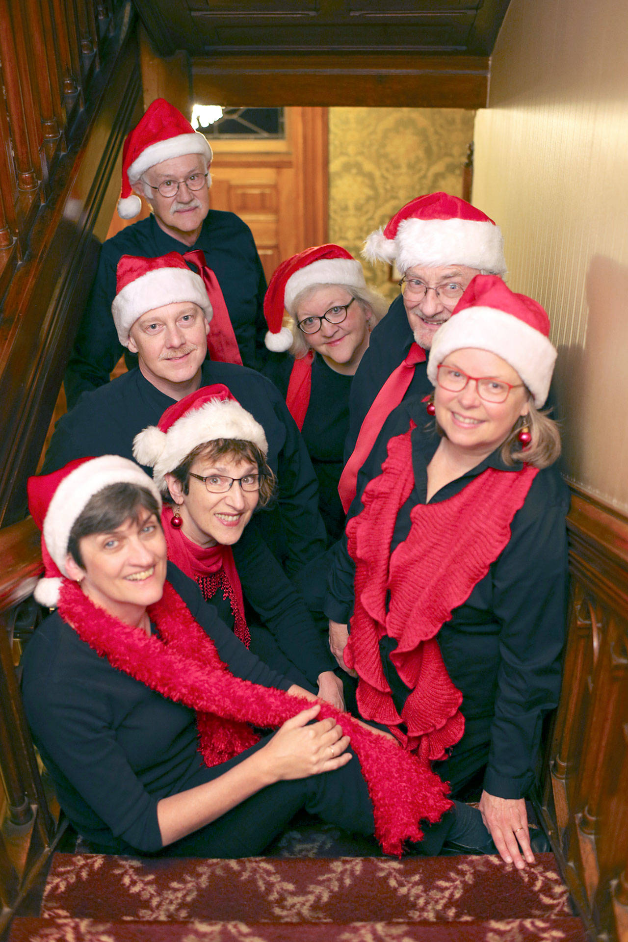 Wild Rose Chorale will host holiday concerts tonight and Sunday at First Presbyterian Church. Singers are (clockwise, from top) Doug Rodgers, Marj Iuro, Al Thompson, Lynn Nowak, Leslie Lewis, JES Schumacher and Charles Helman. (Barney Burke)