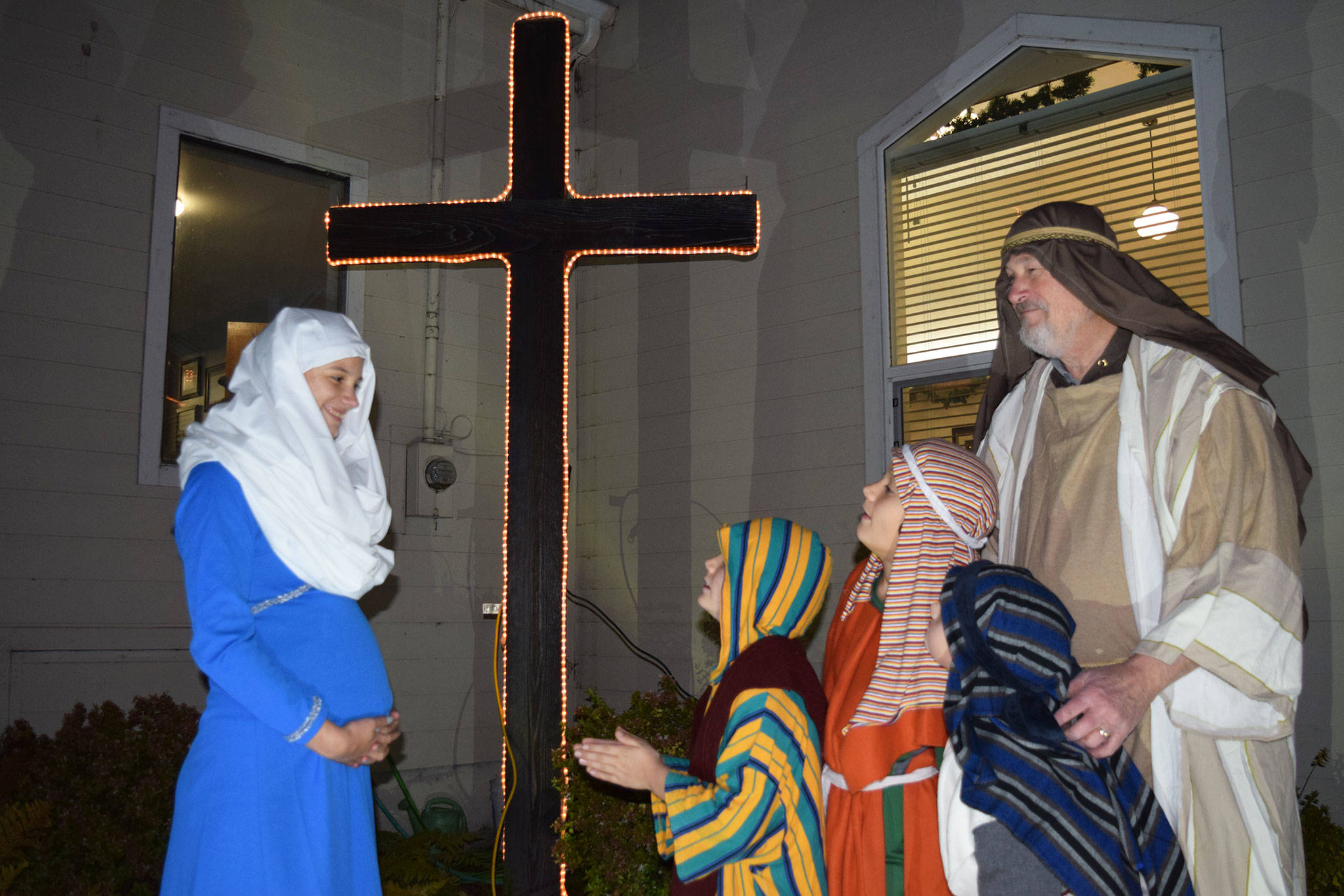 Members of the Sequim Valley Nazarene Church, from left, Melanie Byrne as Mary, with Marcus Byrne, Malachi Byrne, and Gabriel Robbins as shepherds, and David Stoeckl, as Isaiah, rehearse for the church’s living nativity with the first set of tours set for this Saturday and Dec. 15. Erin Hawkins/Olympic Peninsula News Group