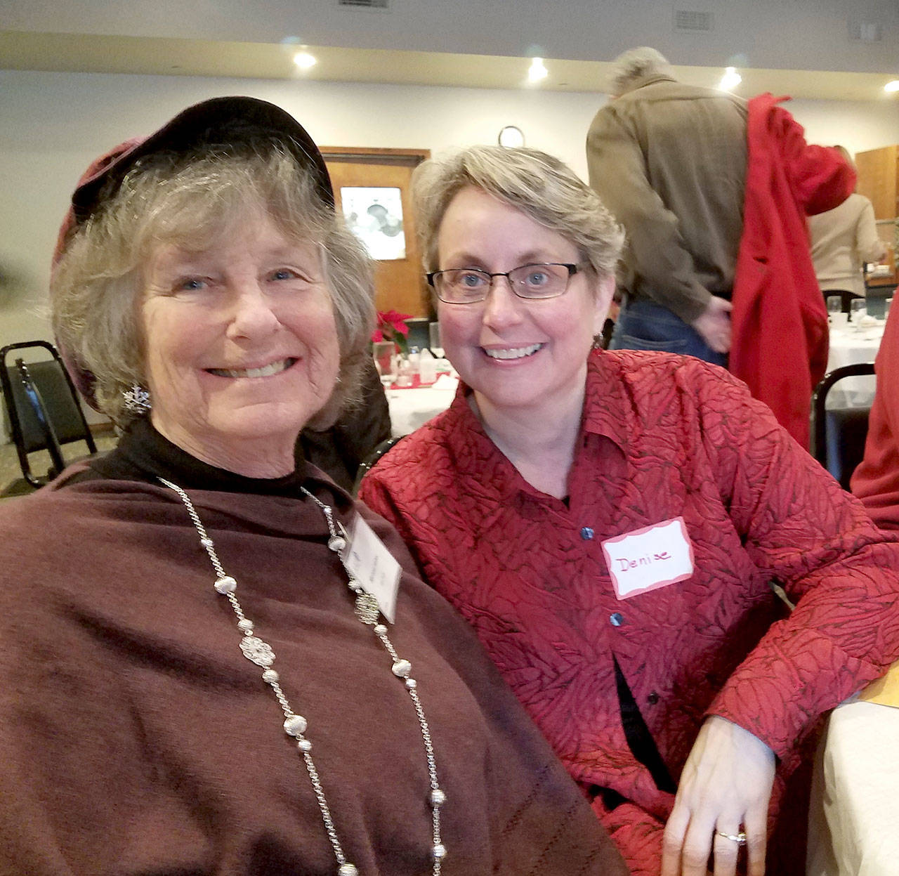 Denise Winter, recipient of the Port Townsend American Association of University Women Woman of Excellence Award, right, poses with Michael Kubec, the chair of the Woman of Excellence committee.