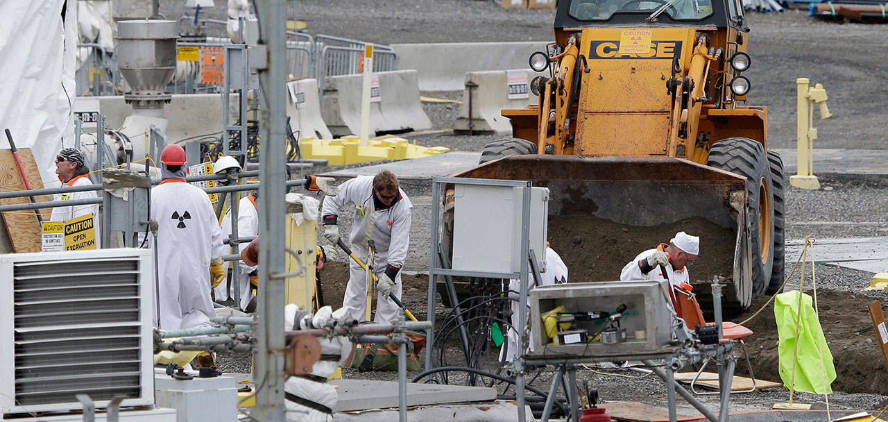 In this March 6, 2013 file photo, workers are shown at the ‘C’ Tank Farm at the Hanford Nuclear Reservation, near Richland. (Ted S. Warren/The Associated Press)