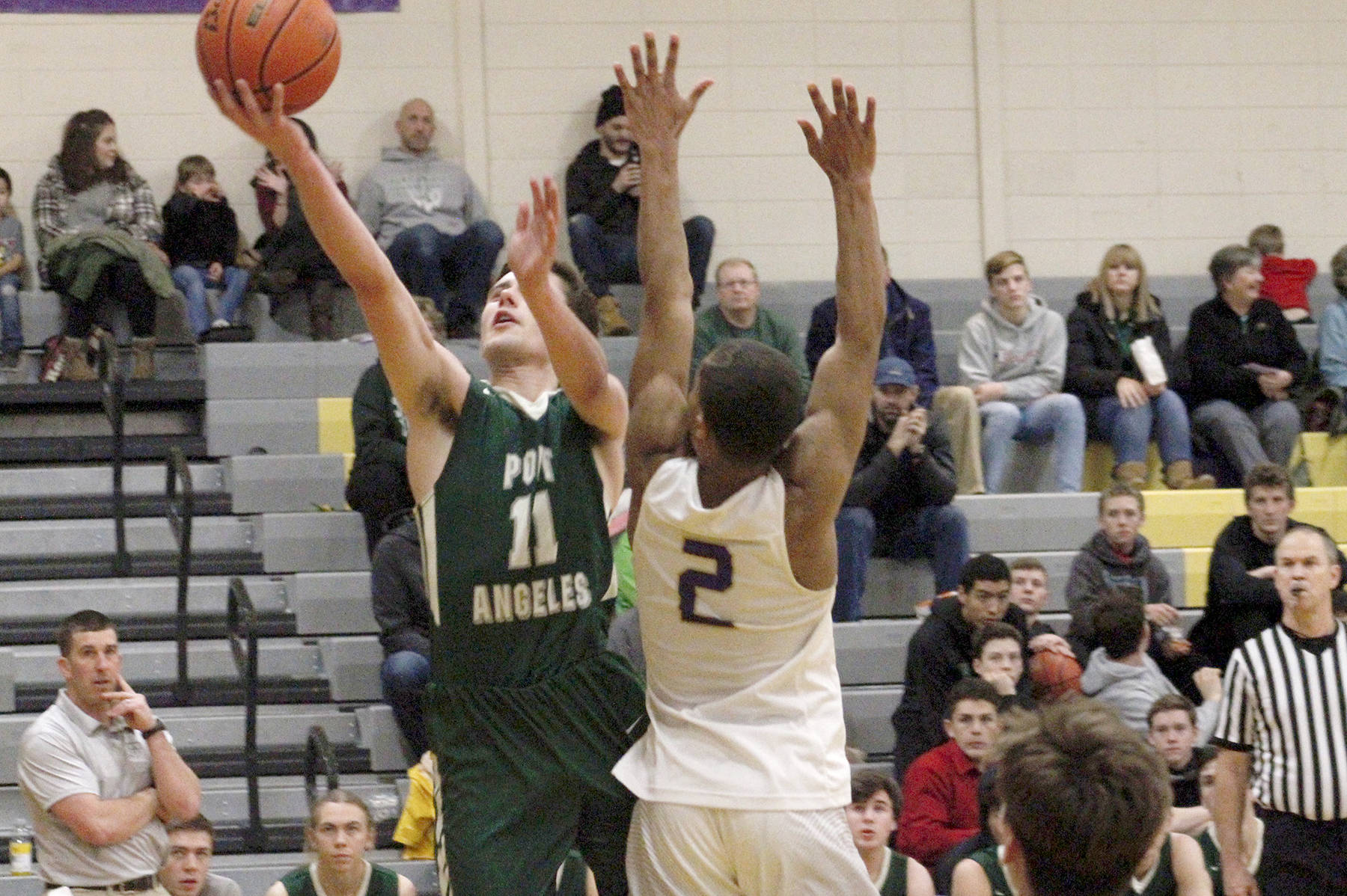 &lt;strong&gt;Mark Krulish&lt;/strong&gt;/Kitsap News Group                                Port Angeles’ Kyle Benedict goes up for a layup while defended by North Kitsap’s Kobe McMillian. Benedict led the Riders with 14 points in a 58-54 loss to the Vikings on Tuesday night in Poulsbo.