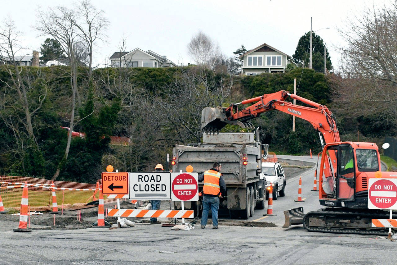 Work continues at the intersection of Quincy and Washington streets in downtown Port Townsend to create new pedestrian crossings that are Americans with Disabilities Act accessible. The work is part of the Jefferson Street Sidewalk Extension project and is expected to be completed in January. (Jeannie McMacken/Peninsula Daily News)