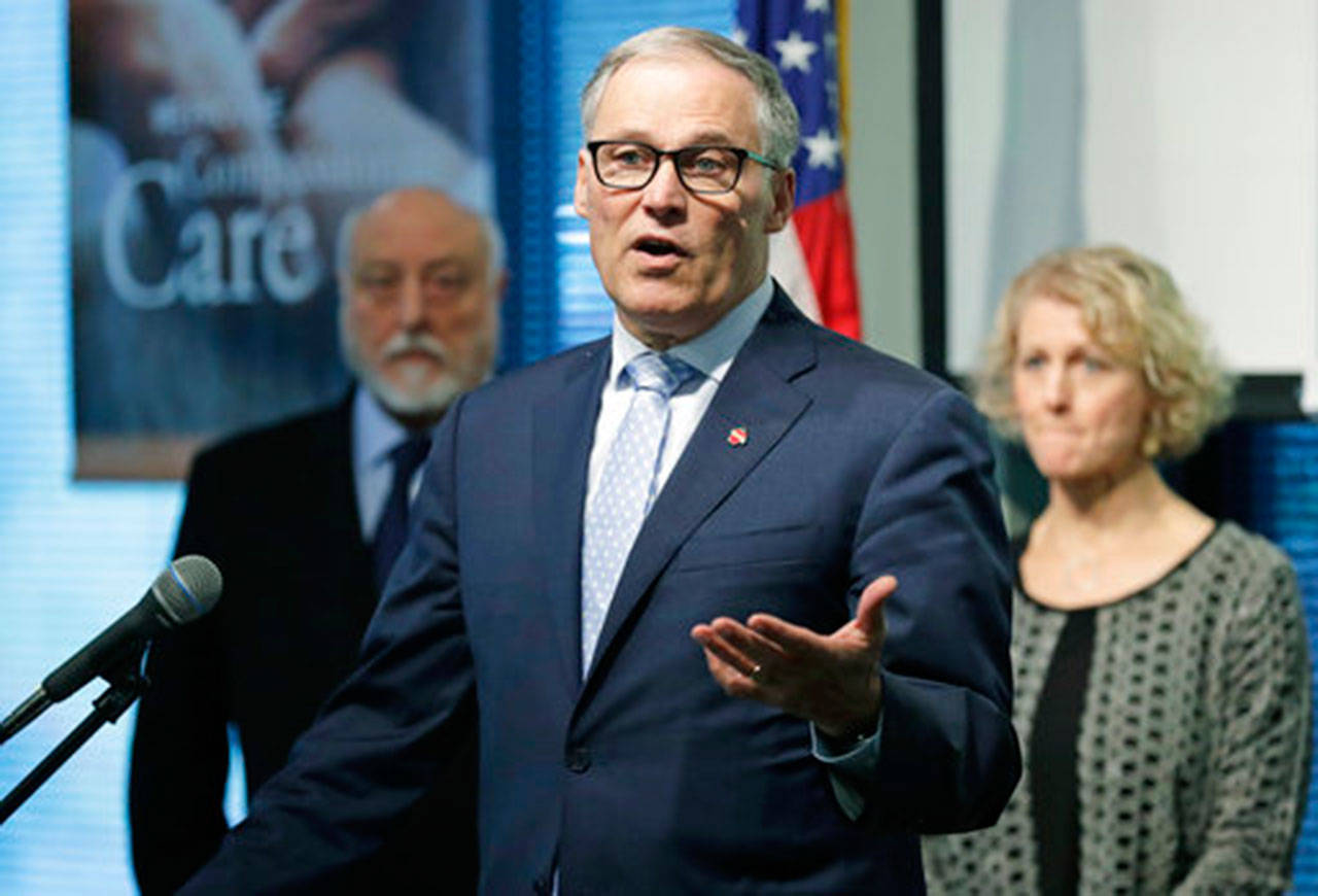 Gov. Jay Inslee speaks at Navos Mental Health and Wellness Center in Burien last Tuesday about his budget and policy plans for fixing the state’s struggling mental health system. (Ted S. Warren/The Associated Press)