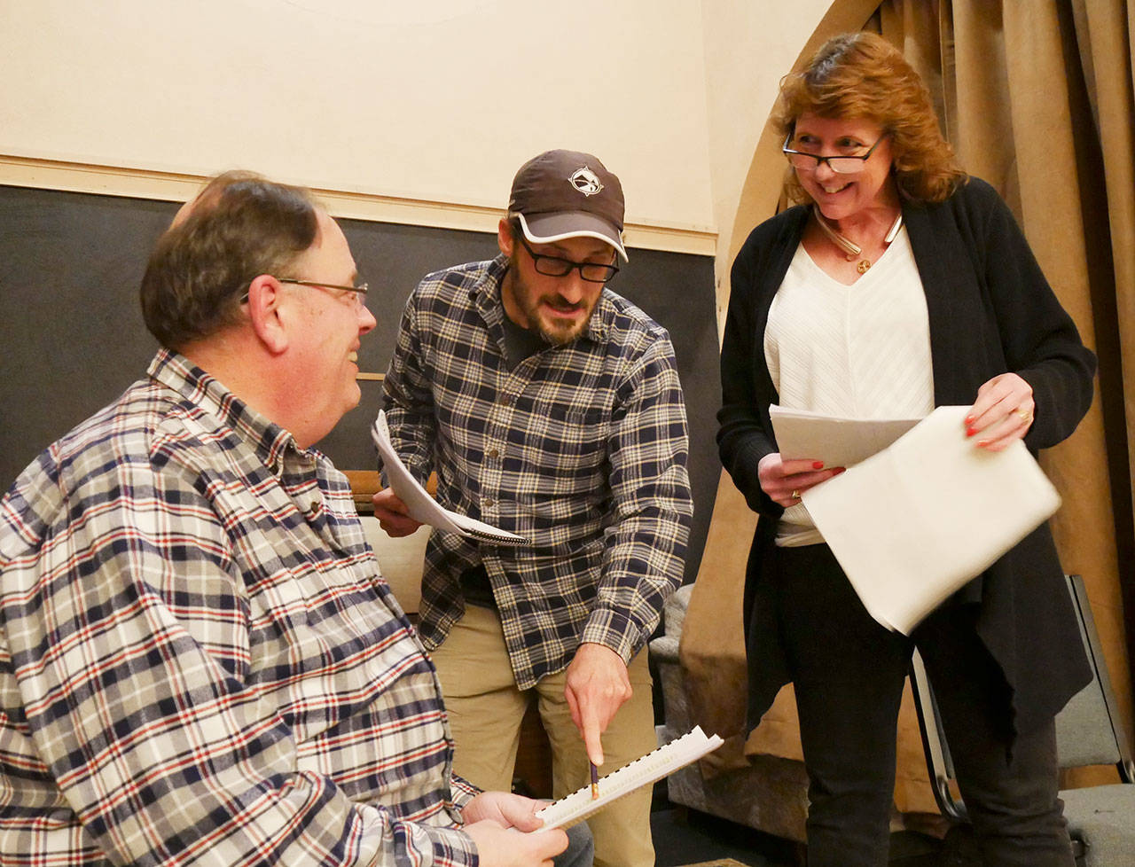 Director Josh Sutcliffe, center, works with cast members Steve Rodeman, left, and Sara Nicholls for the upcoming Olympic Theatre Arts production of “Bakersfield Mist,” which hits the stage Jan. 18.