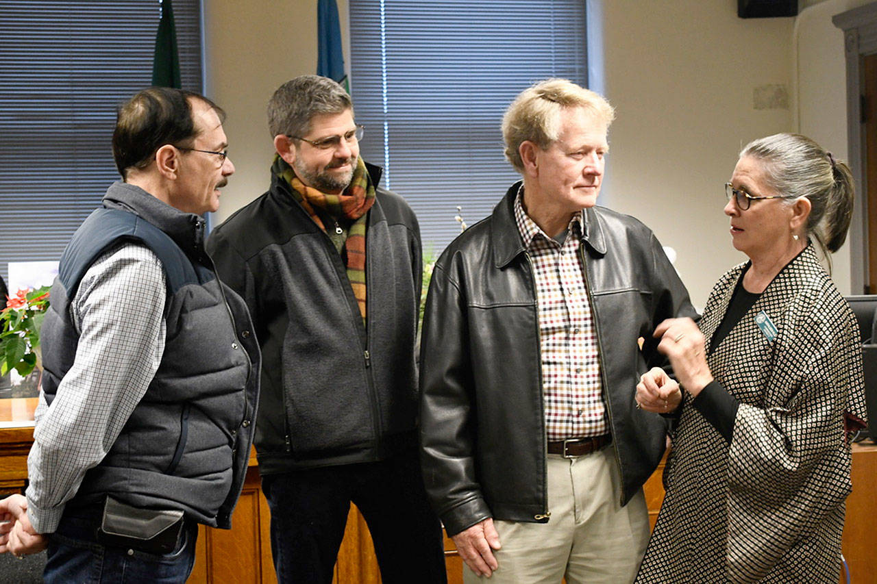 Clallam County Commissioners, from left, Bill Peach, Mark Ozias and Randy Johnson attended the retirement party for Jefferson County Commissioner Kathleen Kler. The reception was standing-room only, with many local elected officials, staff and colleagues thanking Kler. (Jeannie McMacken/Peninsula Daily News)