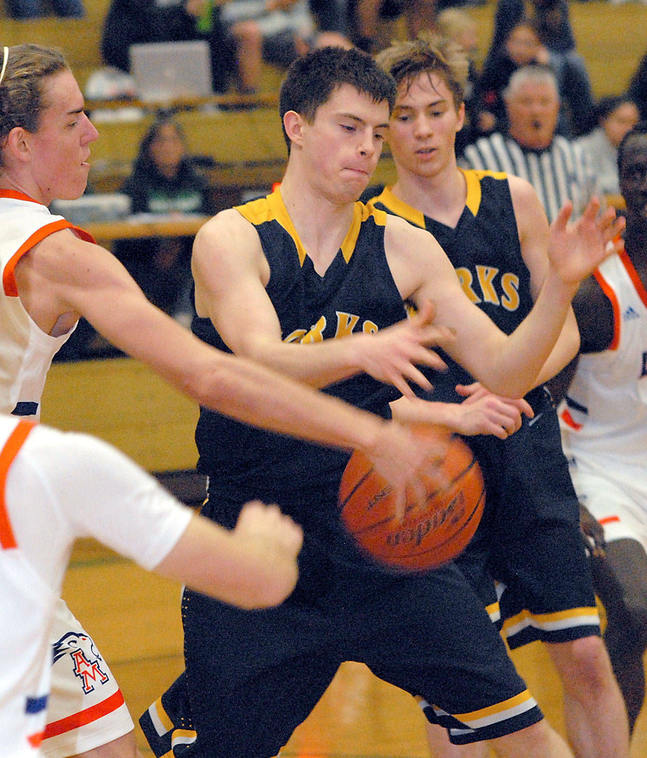 Keith Thorpe/Peninsula Daily News Forks’ Brandon Baar, center, has the ball stripped away by Auburn-Mountainview’s Brandon Miguel on Friday night at Port Angeles High School. Looking on at right is Baar’s teammate Seth Johnson.