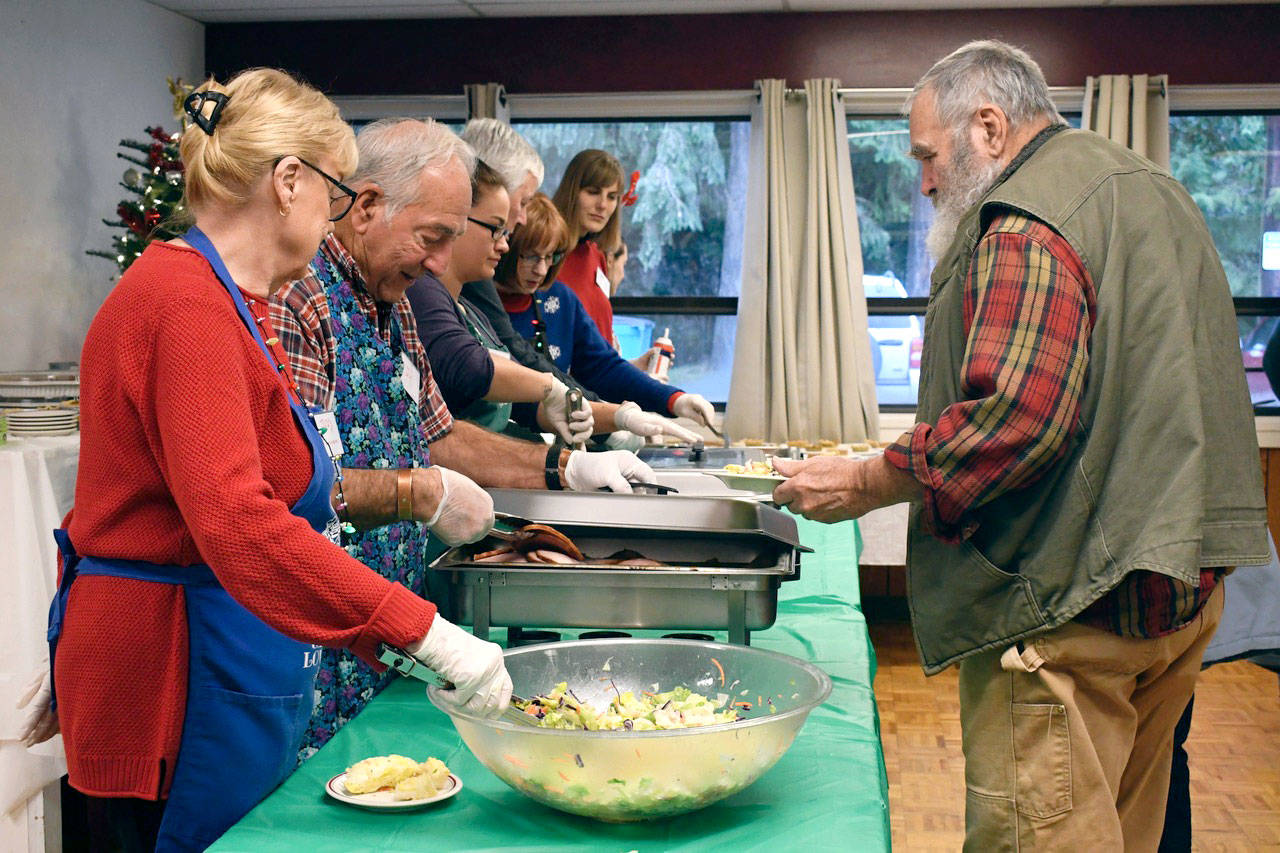 Volunteers at the Tri-Area Community Center were planning to serve 150 meals on Tuesday. Drivers delivered 86 meals to go. The program was organized by the nonprofit Holiday Meals, which plans to add an Easter dinner and once-a-month Sunday suppers in 2019. (Jeannie McMacken/Peninsula Daily News)