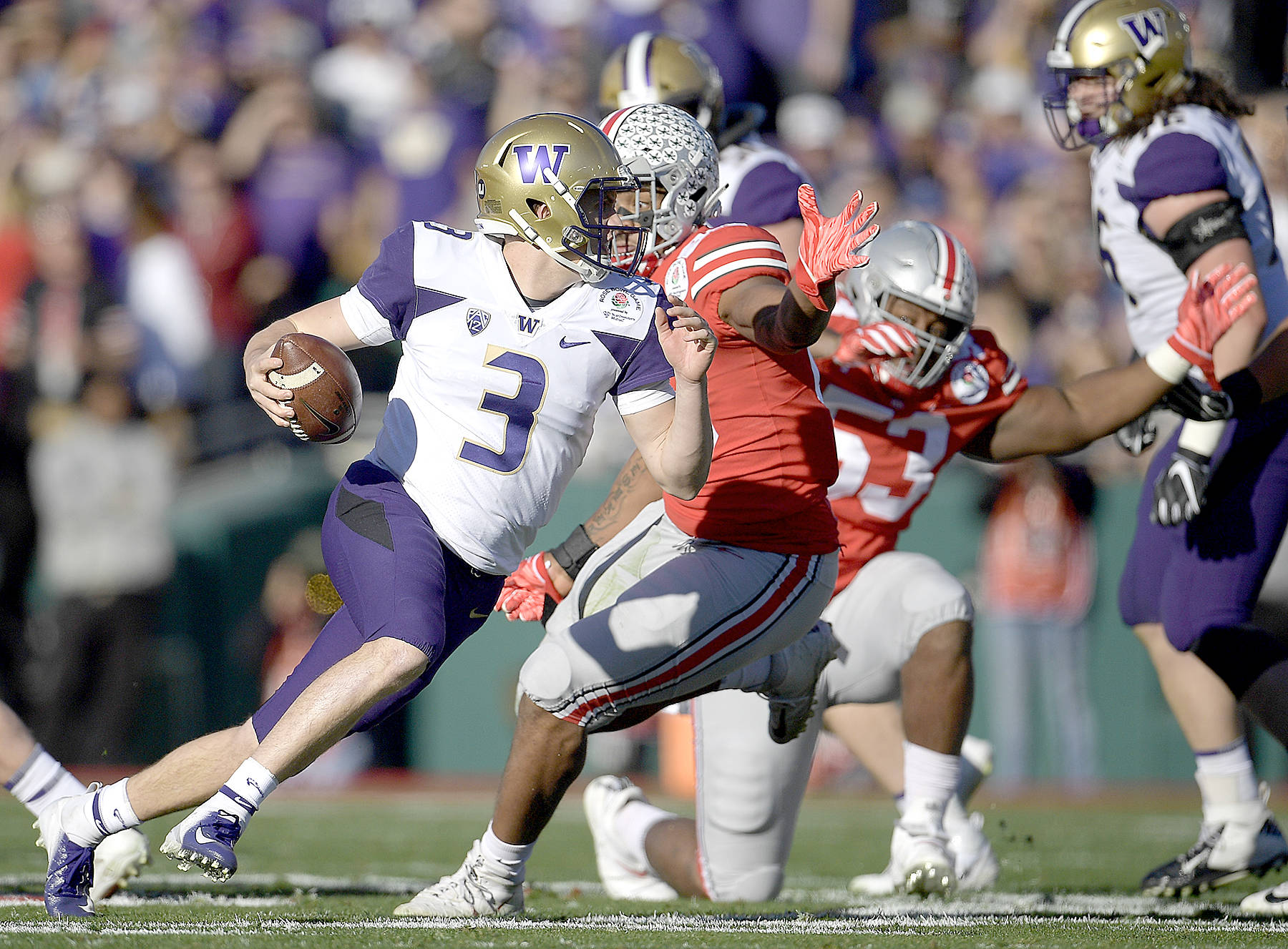 Washington quarterback Jake Browning runs against Ohio State during the first half of the Rose Bowl NCAA college football game Tuesday, Jan. 1, 2019, in Pasadena, Calif. (AP Photo/Mark J. Terrill)