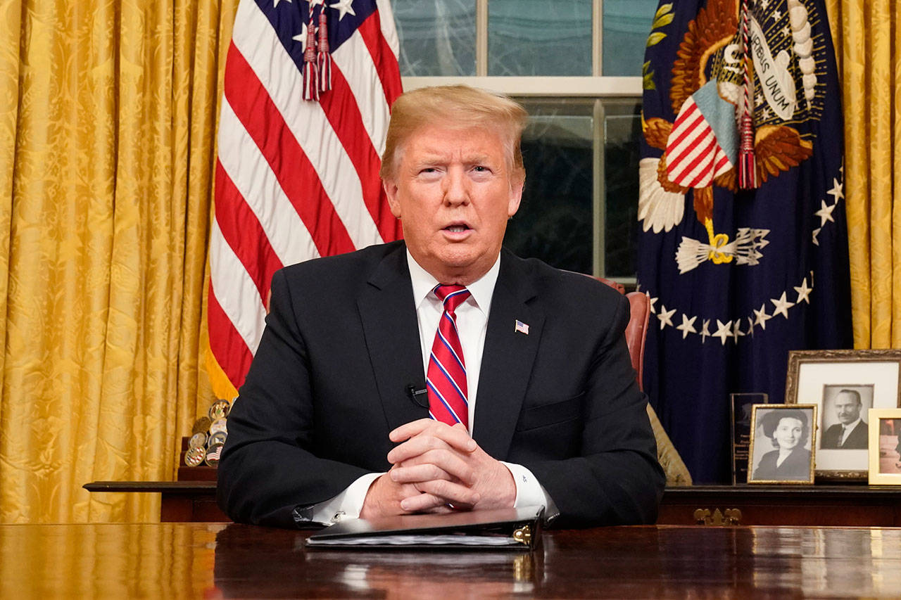 President Donald Trump speaks from the Oval Office of the White House as he gives a prime-time address about border security on Tuesday. (Carlos Barria/pool photo via AP)