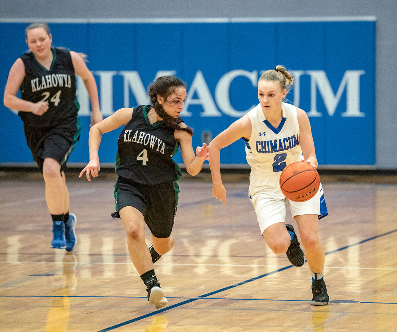 Steve Mullensky/for Peninsula Daily News Chimacum’s Jada Trafton, right, dribbles past Klahowya’s Maile Lueck during a game in Chimacum on Friday.