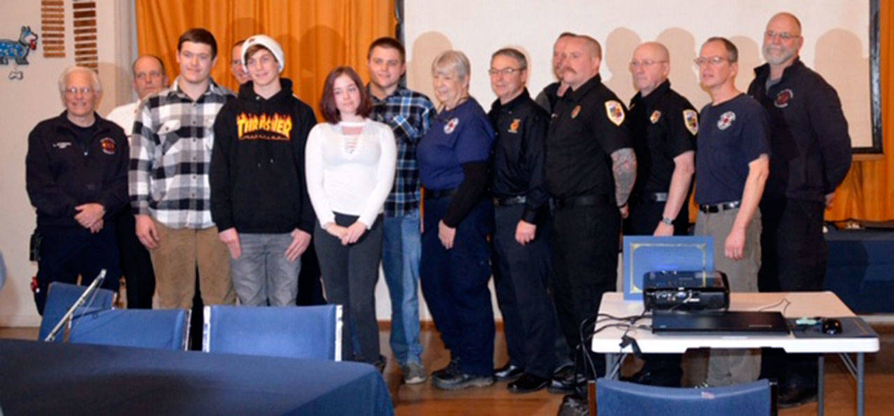 Three teens involved in a wreck over the summer, Tanner Bradeen, Arianna Pharr and Ryan Garber, met first responders who helped at the scene during Clallam Fire District No. 4’s annual awards banquet Saturday.