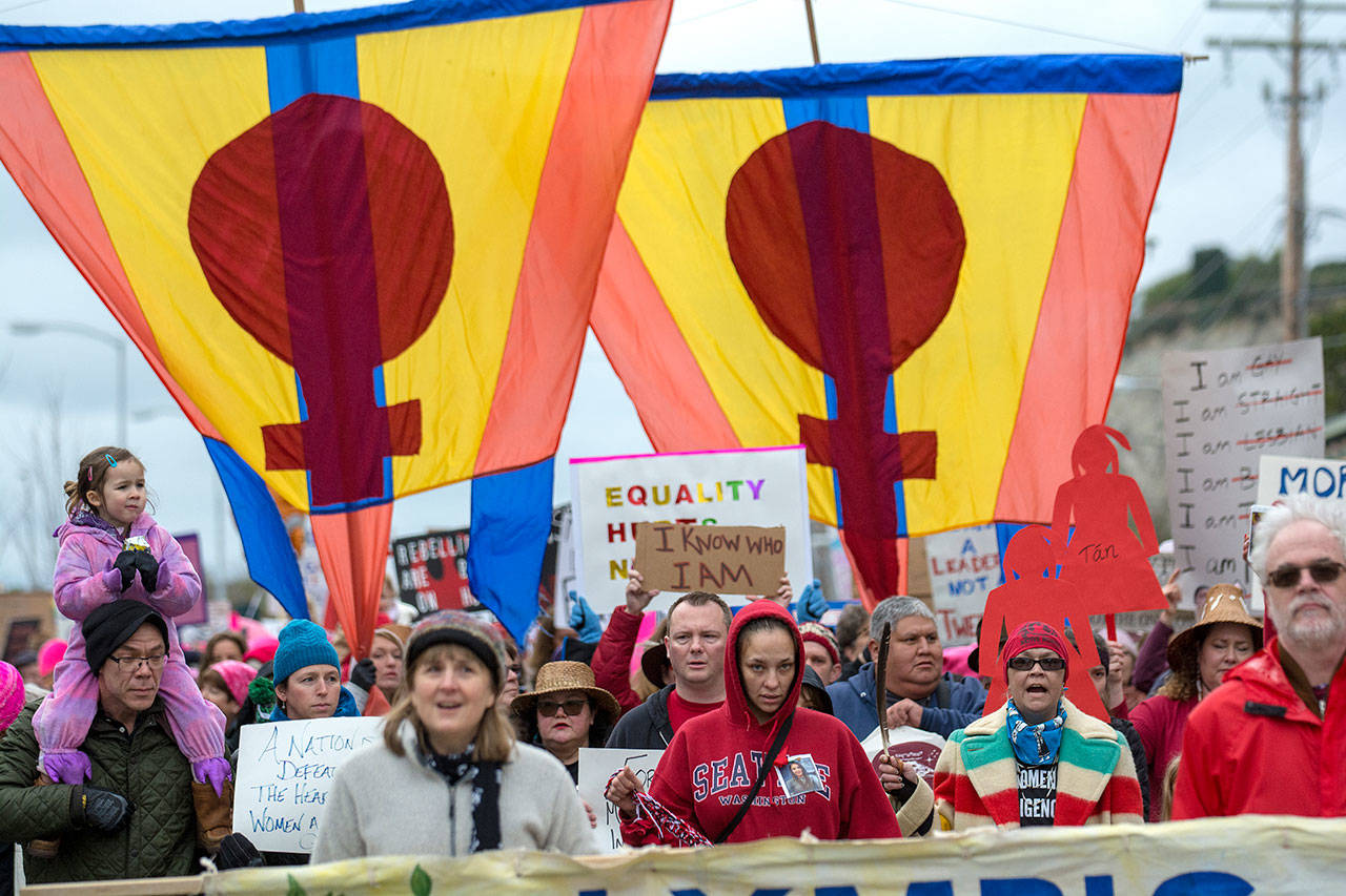 An estimated 1,000 people marched down Water Street during the the third annual Olympic Peninsula Womxn’s Wave on Sunday. (Jesse Major/Peninsula Daily News)