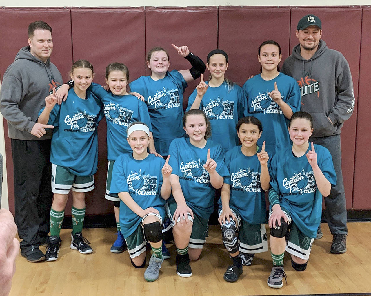 PA Elite won the 5th grade girls basketball championship over the weekend at the annual Port Angeles Parks and Recreation Martin Luther King Jr. Tournament. Team members and coaches are, back row from left, Coach Dustin Clark, Kennedy Ronglein, Lindsay Smith, Leah Flanagan, Becca Manson, Clare Bowechop, Coach Ryan Smith and front, Teanna Clark, Shyanne Hunter, Qwaapeys Greene and Brooklyn Johnson.