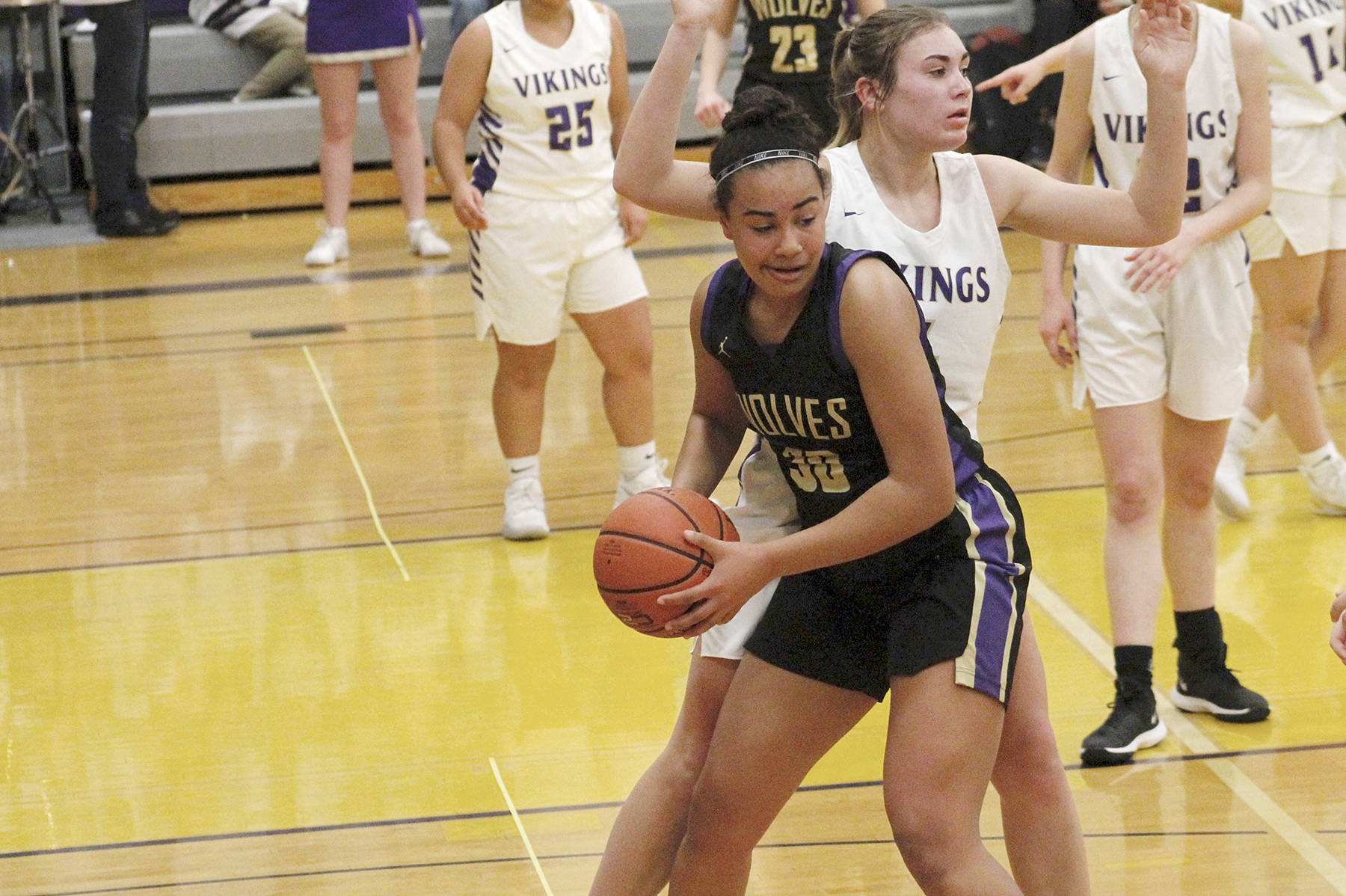 &lt;strong&gt;Mark Krulish&lt;/strong&gt;/Kitsap News Group                                Sequim’s Jayla Julmist, with ball, is guarded by North Kitsap’s Maddie Pruden.