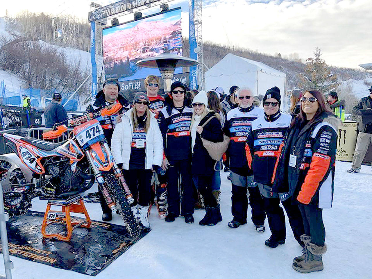 Port Angeles’ Jake Anstett, in rear third from left, poses with his Team Peterson Racing teammates after winning the bronze medal in the snow hill climb at the X Games on Sunday in Aspen, Colo. (Team Peterson Racing)