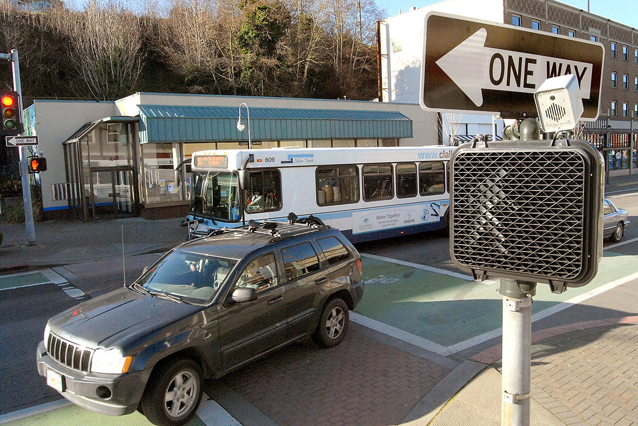 Traffic makes its way through the intersection of First and Laurel streets in downtown Port Angeles on Tuesday. (Keith Thorpe/Peninsula Daily News)