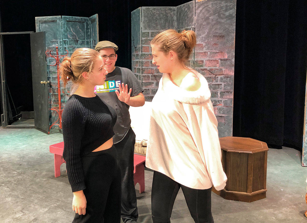 Samantha Weinert, left, is confronted by Sophie Orth, as Rylan MacDonald tries to ease the tension.