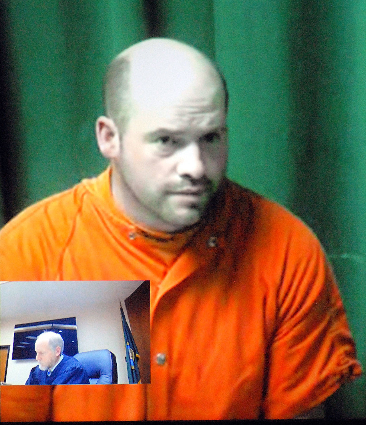 Ryan Warren Ward, 37, appears by video link during his first appearance in Clallam County Superior Court in Port Angeles on Thursday on charges of aggravated first-degree murder with firearms enhancements related to a triple homicide in December. Inset in the two-way video appearance is Superior Court Judge Brian Coughenour. (Keith Thorpe/Peninsula Daily News)