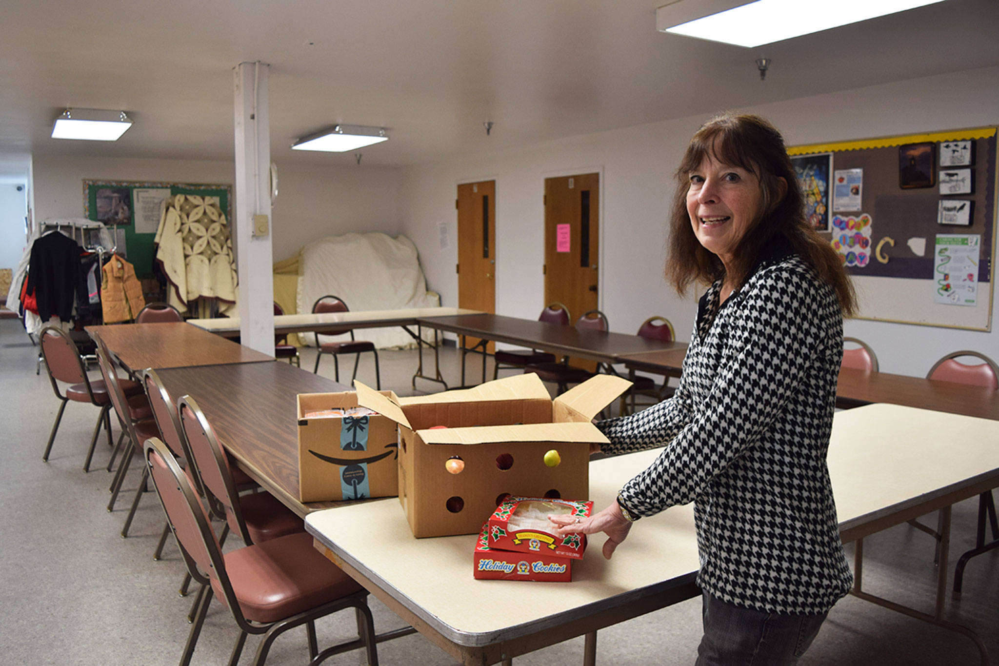 Jean Pratschner, volunteer coordinator for the Sequim Community Warming Center, unpacks donated snacks and goodie bags to give out at the center. Starting tonight, the center will be open from 9 p.m. to 7 a.m. every night. (Erin Hawkins/Olympic Peninsula News Group)