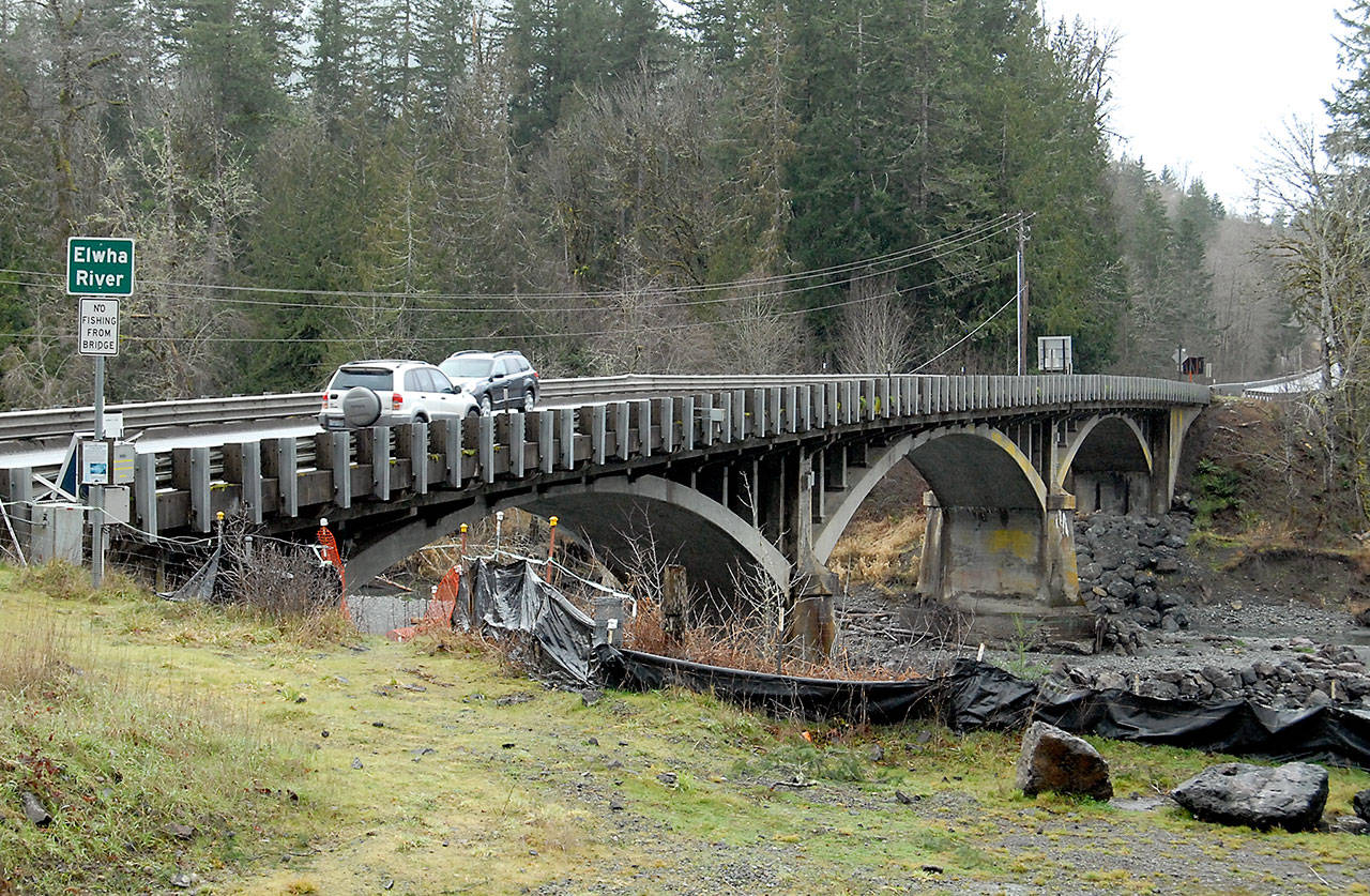 Cars are driven across the U.S. Highway 101 bridge over the Elwha River west of Port Angeles on Saturday. State transportation officials will brief the Port Angeles City Council and the public Tuesday about plans to replace the aging span. (Keith Thorpe/Peninsula Daily News)