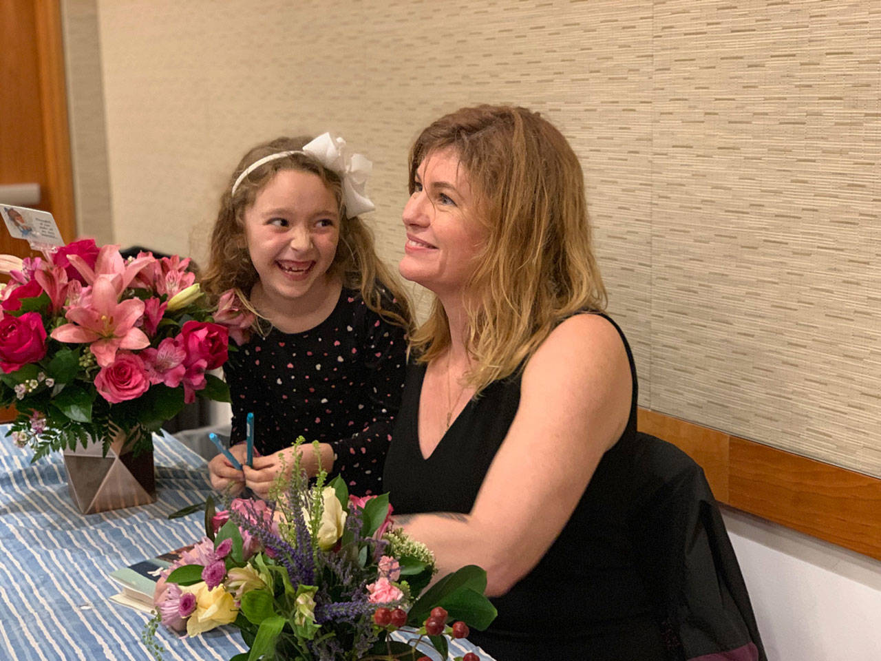 Vanessa McGrady and her daughter, Grace — shown here at book signing in Glendale, Calif. — will be at a book event Friday in Port Townsend. McGrady spent several years on the Olympic Peninsula and said she is looking forward to being back in town. (Andrea Sluchan)