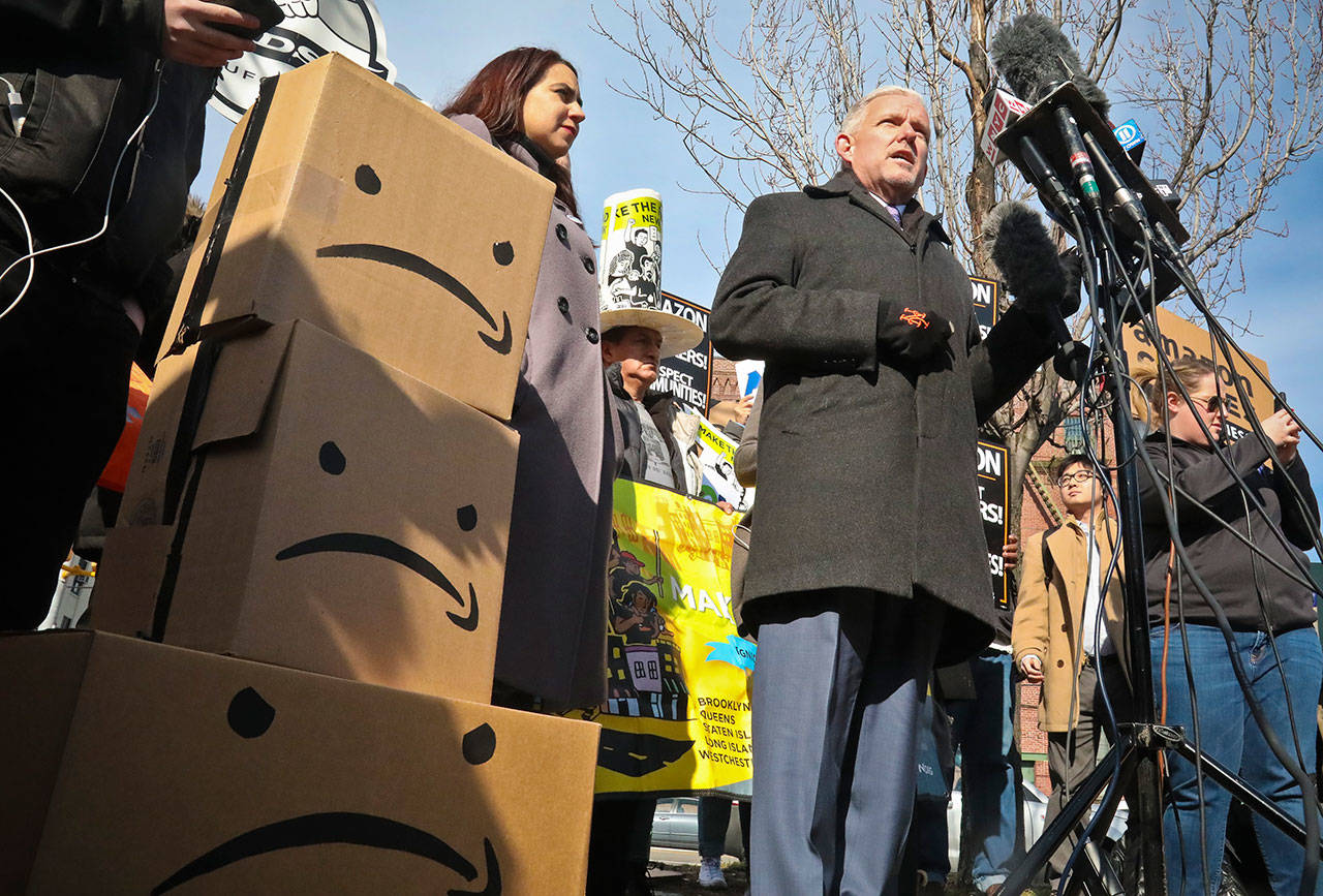 New York City Councilman Jimmy Van Bramer, center, speaks during a conference in Gordon Triangle Park in the Queens borough of New York, following Amazon’s announcement it would abandon its proposed headquarters for the area Thursday. (AP Photo/Bebeto Matthews)