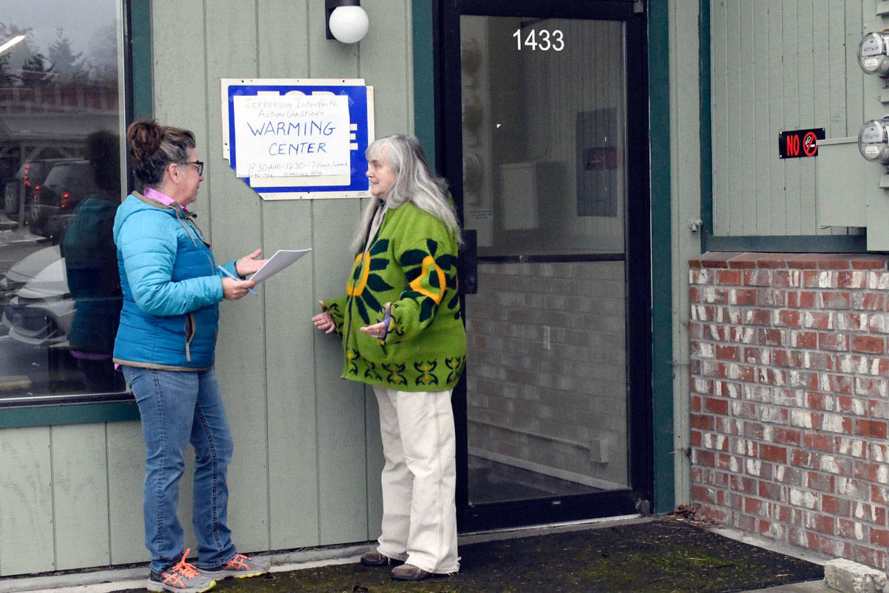 Suzanne DeMasso of Windermere Real Estate, left, and Julia Cochrane of the Interfaith Action Coalition discuss the three-month lease of a Sims Way commercial space that will be a Warming Center for 20 people. The Warming Center will open Saturday at 8:30 a.m. and will be in operation seven days a week. (Jeannie McMacken/Peninsula Daily News)