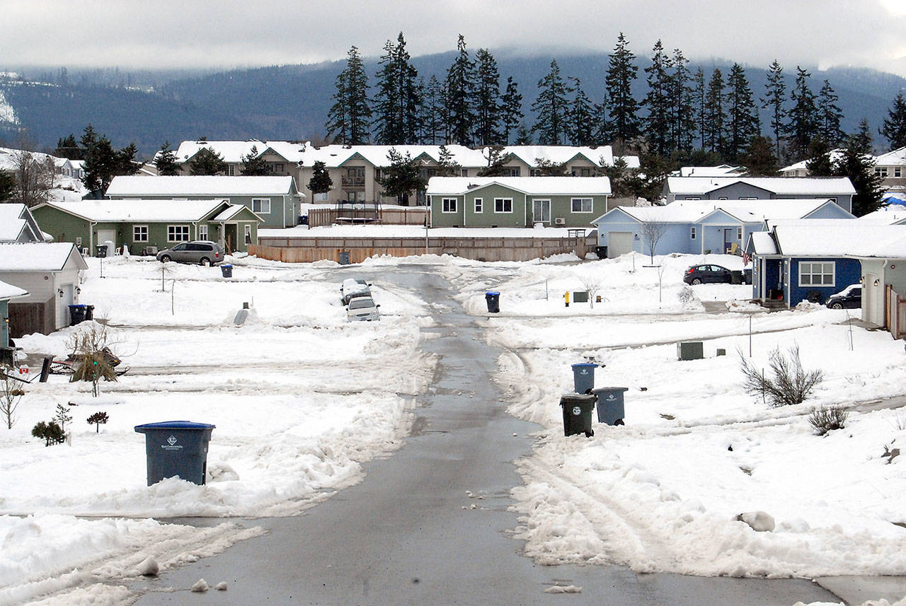 Pendley Court on the west side of Port Angeles remains partially snowbound with only a single lane plowed Friday. (Keith Thorpe/Peninsula Daily News)
