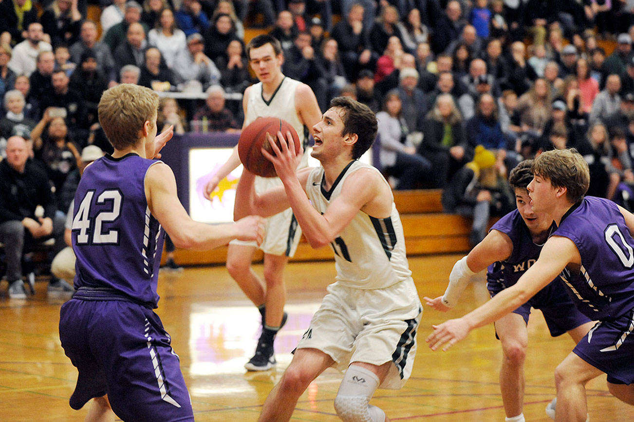 BOYS DISTRICT BASKETBALL: Port Angeles comes up clutch late to hold off Sequim