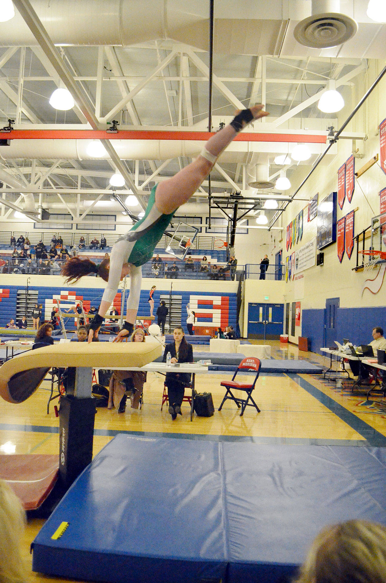 Jackie Mangano                                Port Angeles’ Aiesha LaTourette competes on the vault during the Class 2A/3A West Central District Gymnastics meet at Kent-Meridian High School. LaTourette will compete at the state gymnastics meet at Sammamish High School on Thursday and Friday.