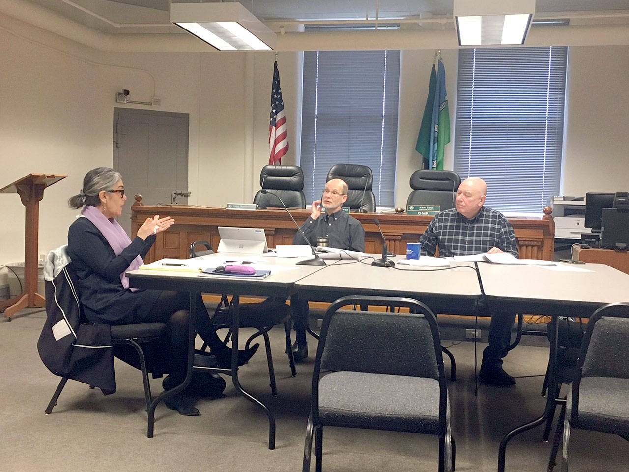 Port Townsend City Council member Michelle Sandoval, left, Jefferson County Administrator Philip Morley, center, and Jefferson County Commissioner David Sullivan, right, discuss housing issues in the first meeting of the Joint Oversight Board on Affordable Housing and Homeless Housing on Wednesday. Sandoval and Sullivan are serving on the board, which will eventually be expanded to five members. (Rob Ollikainen/Peninsula Daily News)