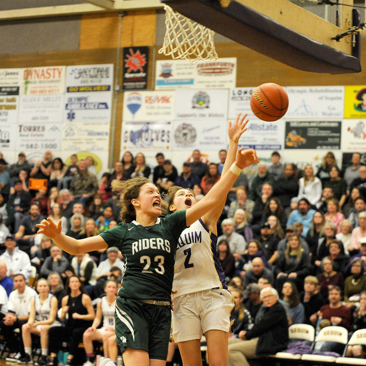 Michael Dashiell/Olympic Peninsula News Group Port Angeles’ Madison Cooke left, was selected as Olympic League 2A Division Girls Basketball MVP in voting conducted by league coaches.