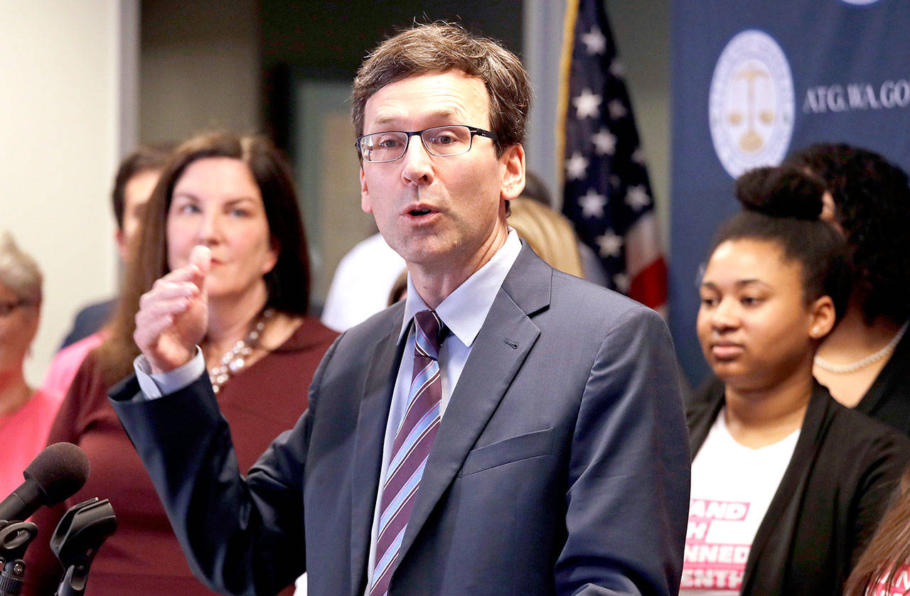 Washington state Attorney General Bob Ferguson speaks at a news conference announcing a lawsuit challenging the Trump administration’s Title X “gag rule” Monday in Seattle. The rule issued last Friday would impact federal funding for reproductive health care and family planning services. (Elaine Thompson/The Associated Press)