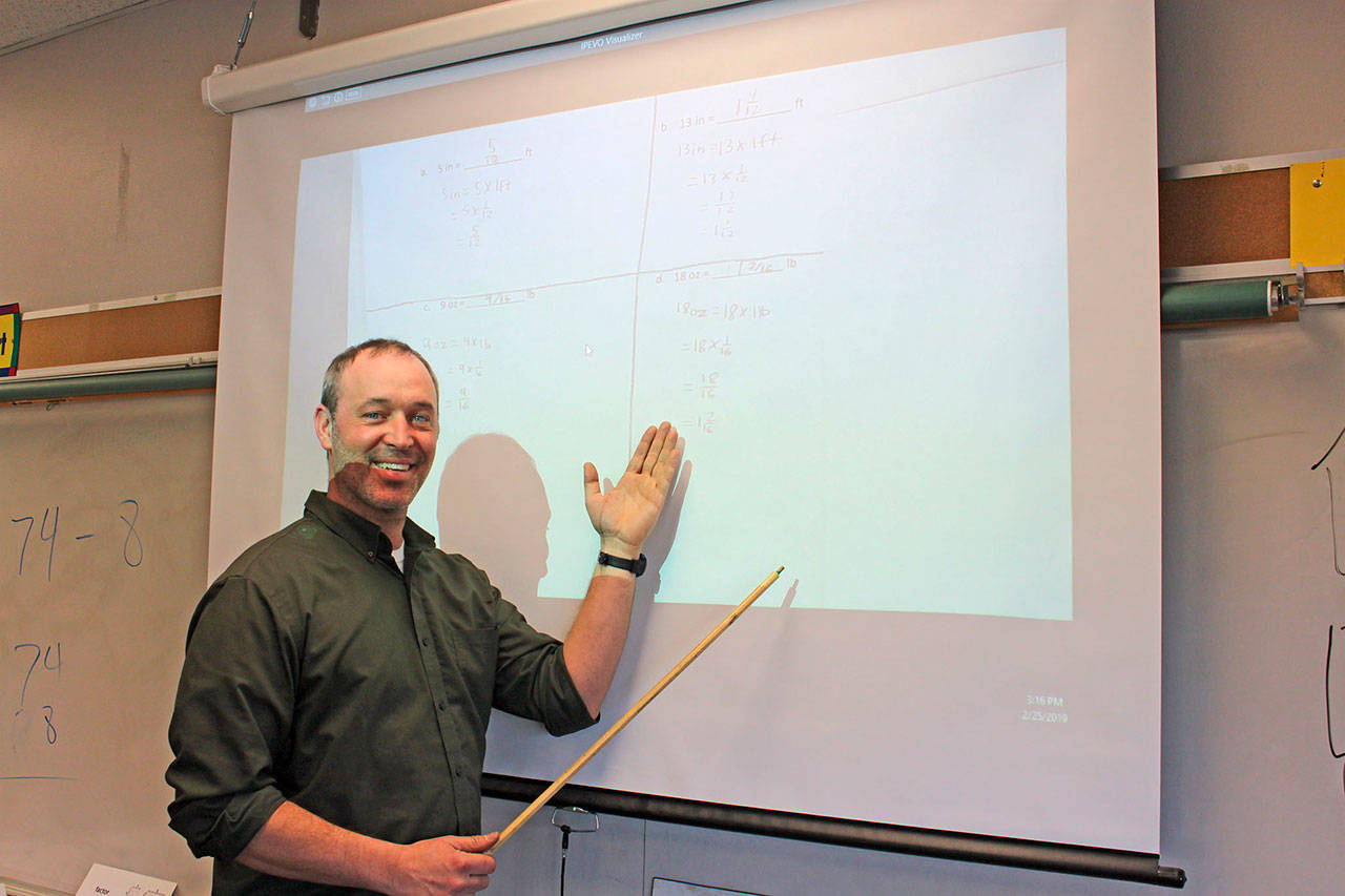 Aaron Reno, a fifth-grade math teacher at Greywolf Elementary School, stands in his classroom Monday.