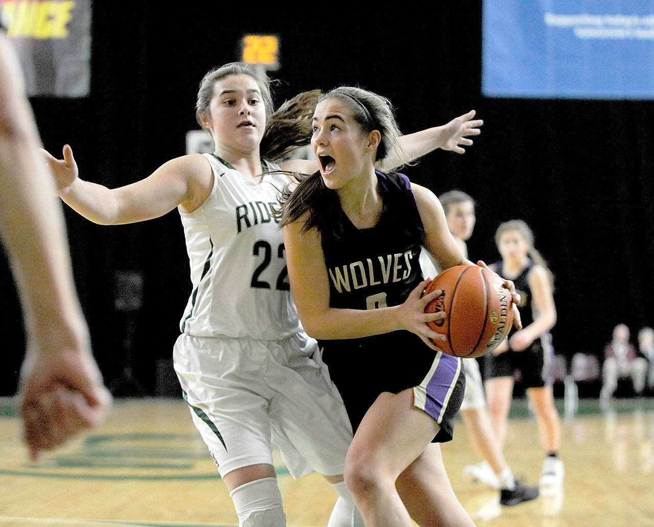 Sequim’s Hope Glasser goes up against Port Angeles’ Eve Burke at the girls 2A state tournament in Yakima. (Michael Dashiell/Olympic Peninsula News Group )