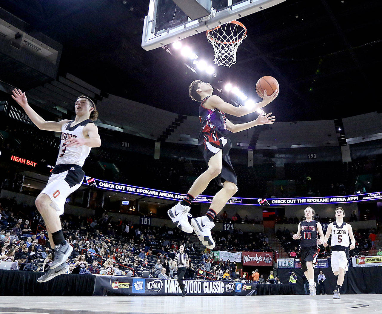Neah Bay’s Jay Brunk goes up for a layup against Odessa at the state 1B basketball tournament Wednesday night. The Red Devils gave the No. 2-ranked team in the state a run for its money in a 81-73 loss. (Chris Johnson/for Peninsula Daily News)