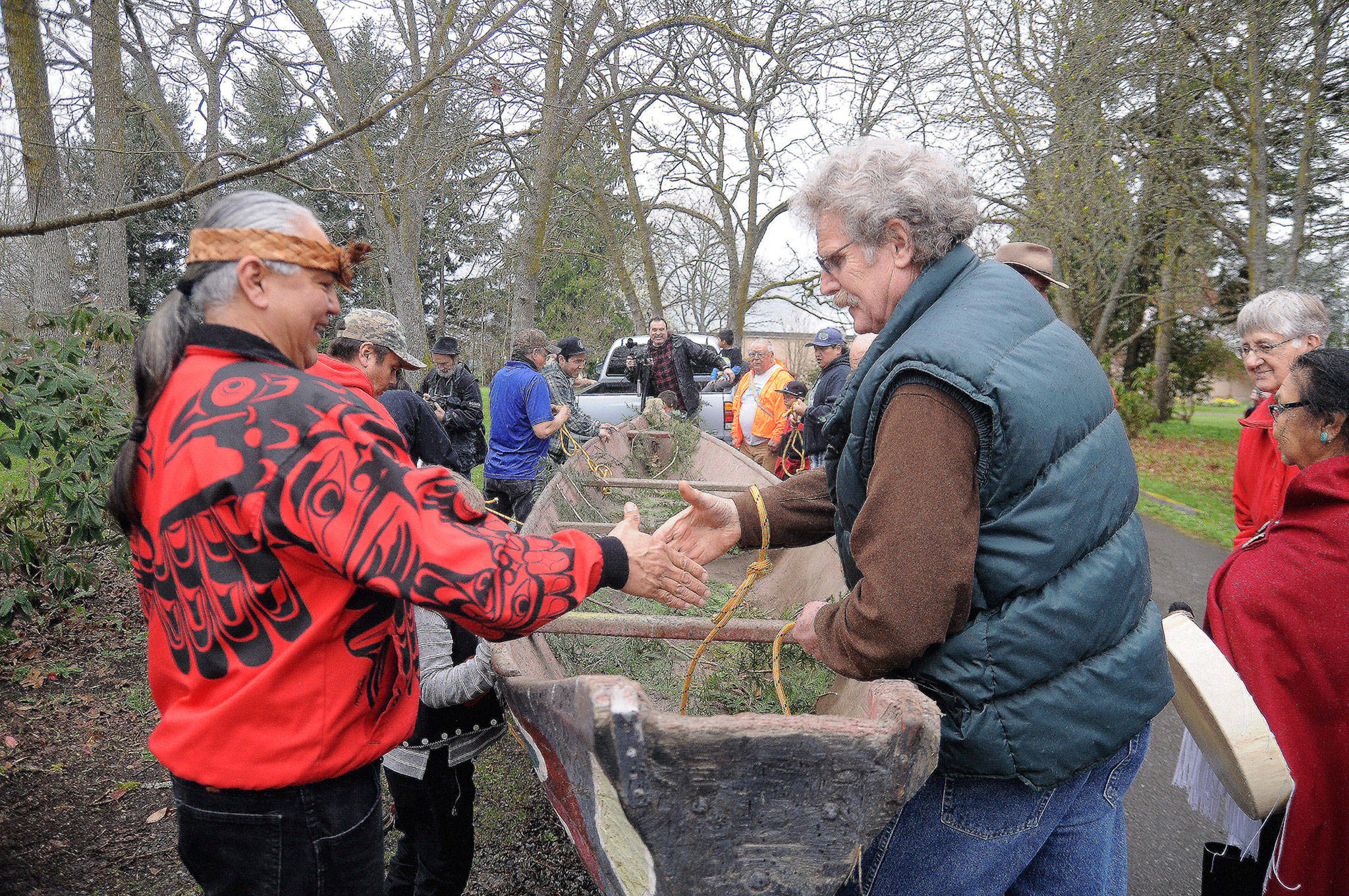 Tribal members prepare a canoe before its removed from Pioneer Memorial Park in Sequim in this file photo from April 2017. The story of the canoes journey from the park to the West End is the topic of Sundays History Tales presentation. (Michael Dashiell/Olympic Peninsula News Group)