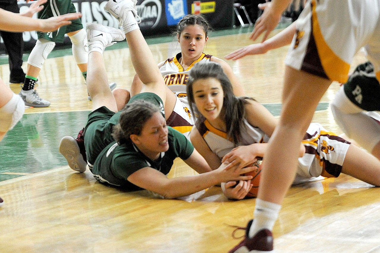 Port Angeles’ Madison Cooke vies for control of the ball with White River’s Taylor Schmidtke during the Roughriders’ 60-55 state quarterfinal loss Thursday at the Yakima SunDome.                                Michael Dashiell/Olympic Peninsula News Group