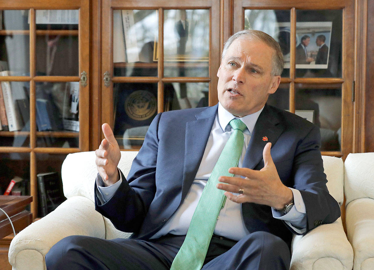 In this Jan. 24 photo, Gov. Jay Inslee takes part in an Associated Press interview in his office at the Capitol in Olympia. Inslee is adding his name to the growing 2020 Democratic presidential field. The 68-year-old announced his bid in Seattle after recent travels to two of the four early-nominating states. (Ted S. Warren/The Associated Press)
