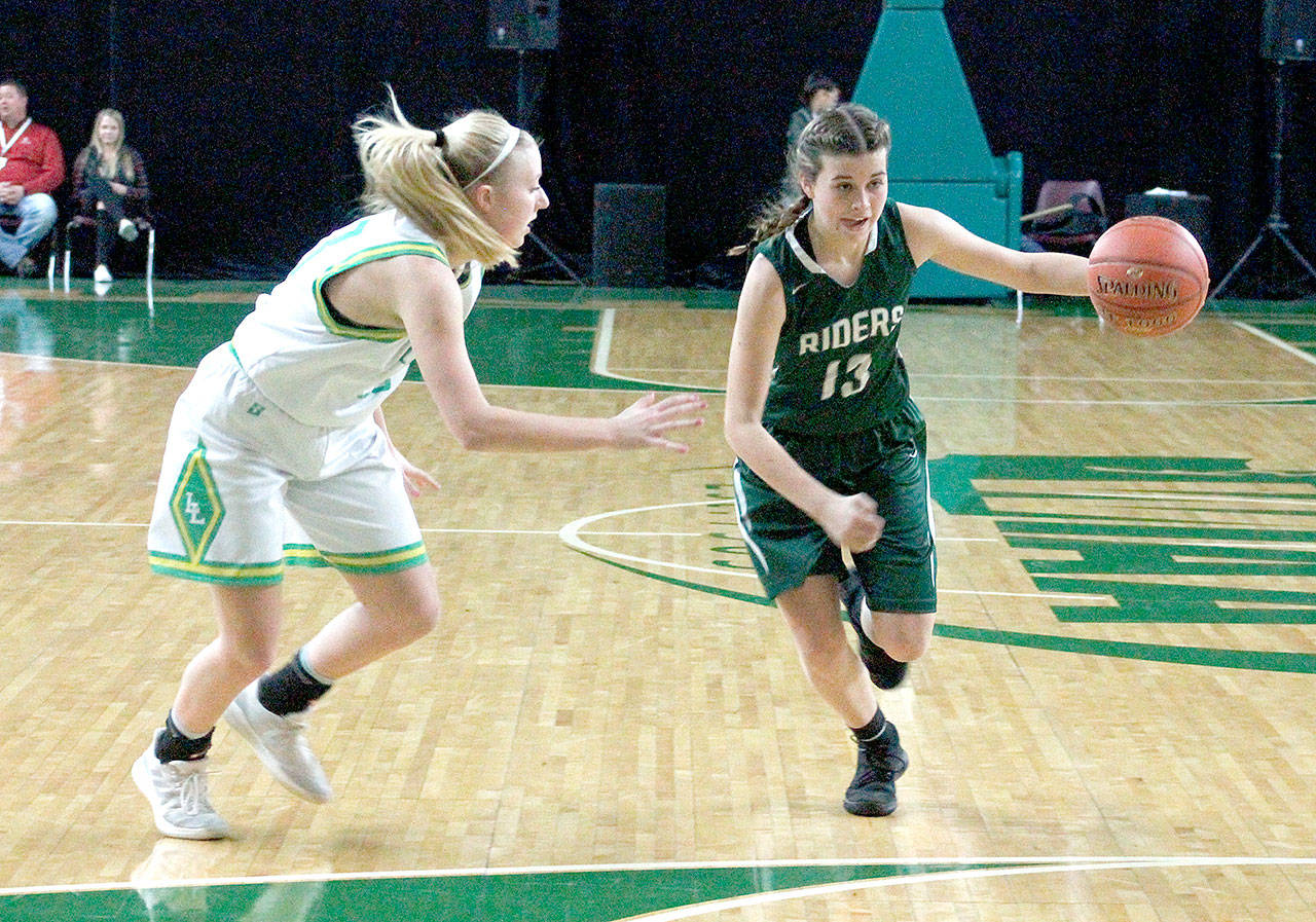 <strong>Mark Krulish</strong>/Kitsap News Group Port Angeles Bailee Larson, right, drives during the Roughriders state tournament loss to Lynden on Friday at the Yakima SunDome.